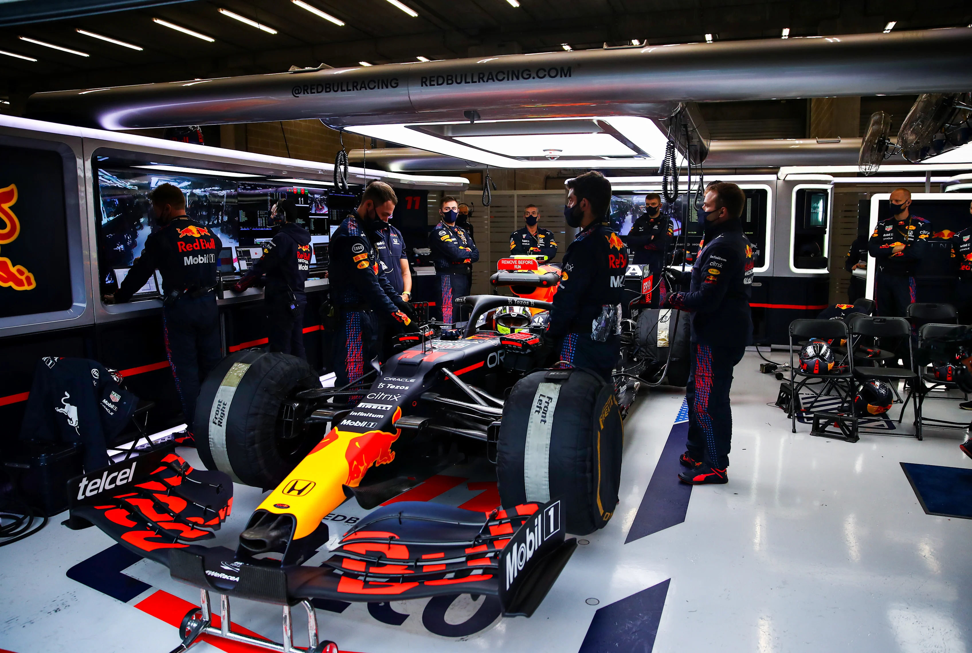 SPA, BELGIUM - AUGUST 29: Sergio Perez of Mexico and Red Bull Racing prepares to leave the garage
