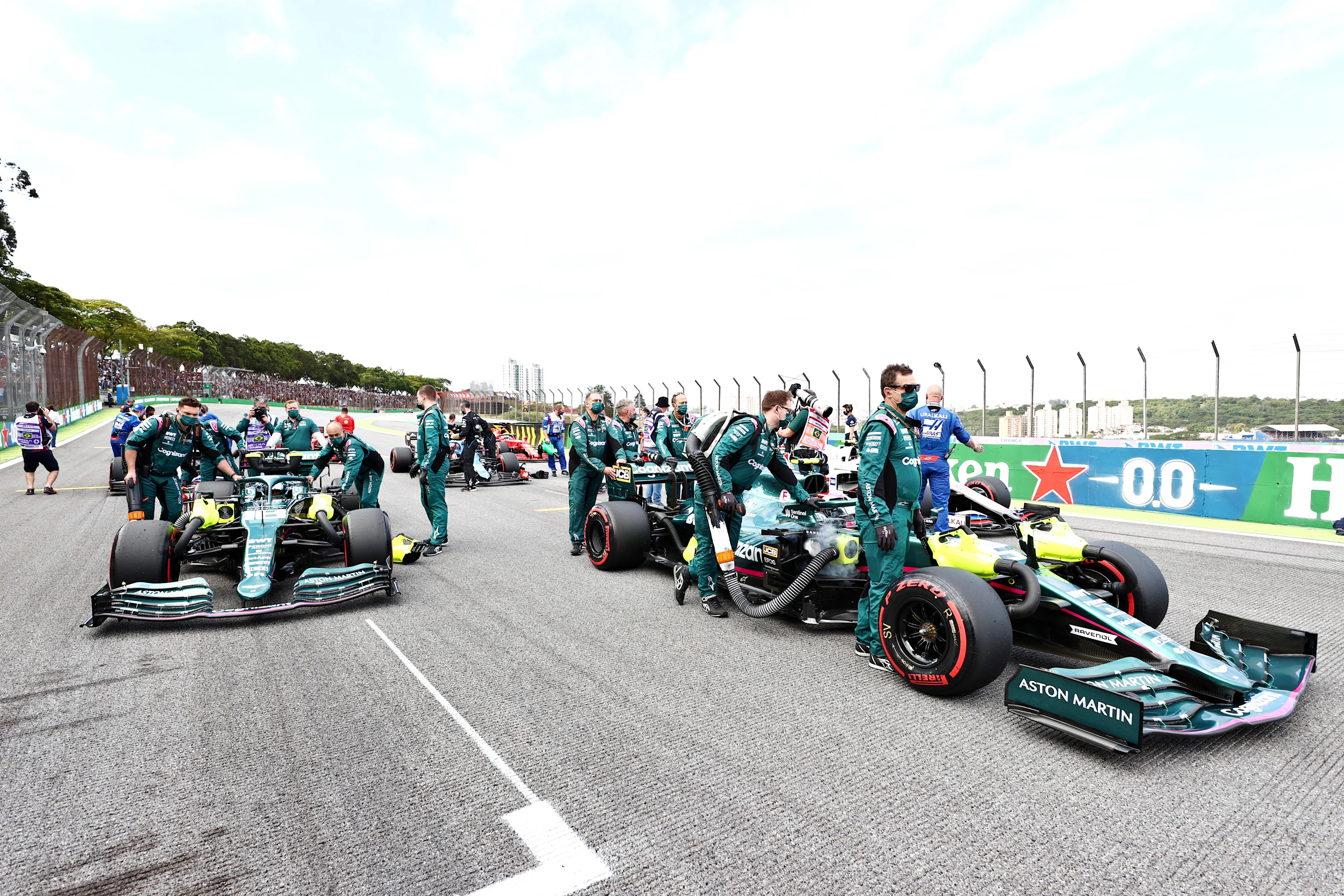 SAO PAULO, BRAZIL - NOVEMBER 13: Lance Stroll of Canada and Aston Martin F1 Team and Sebastian Vettel of Germany and Aston Martin F1 Team take their positions on the grid prior to the sprint ahead of the F1 Grand Prix of Brazil at Autodromo Jose Carlos Pace on November 13, 2021 in Sao Paulo, Brazil. (Photo by Mark Thompson/Getty Images)