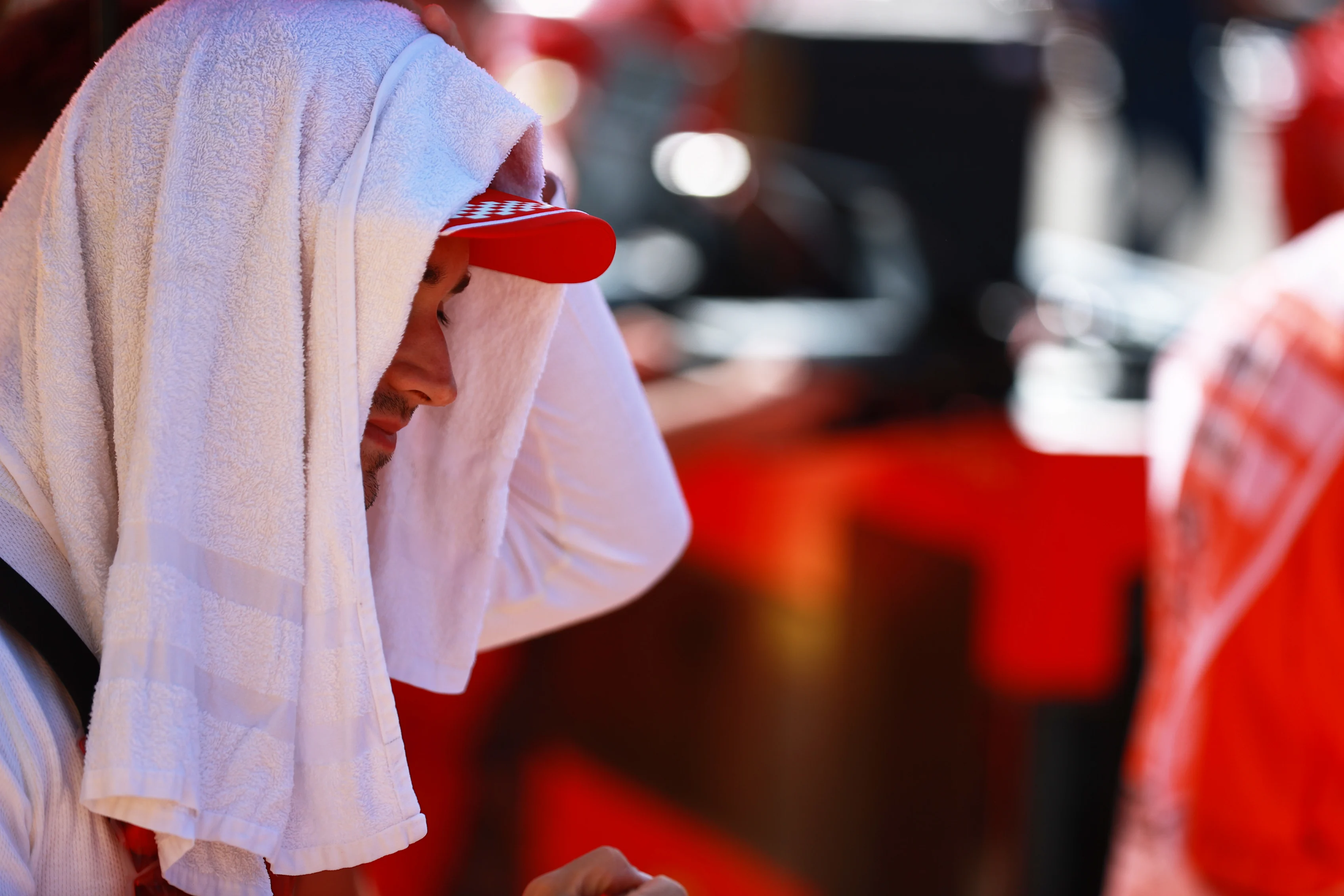 NORTHAMPTON, ENGLAND - JULY 17: Charles Leclerc of Monaco and Ferrari looks on from the grid before the Sprint for the F1 Grand Prix of Great Britain at Silverstone on July 17, 2021 in Northampton, England. (Photo by Mark Thompson/Getty Images)