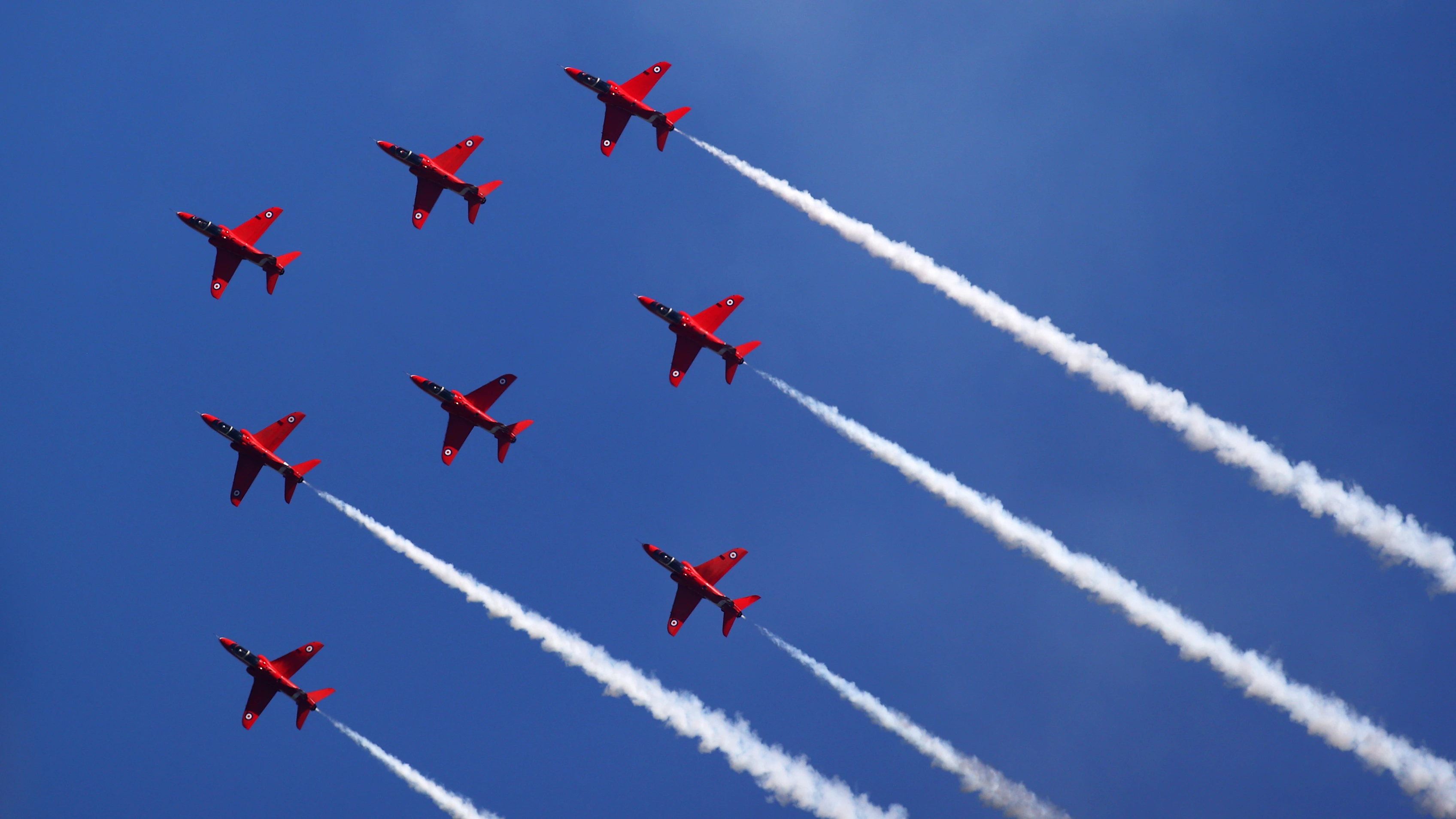 NORTHAMPTON, ENGLAND - JULY 18: The Red Arrows perform above the circuit before the F1 Grand Prix