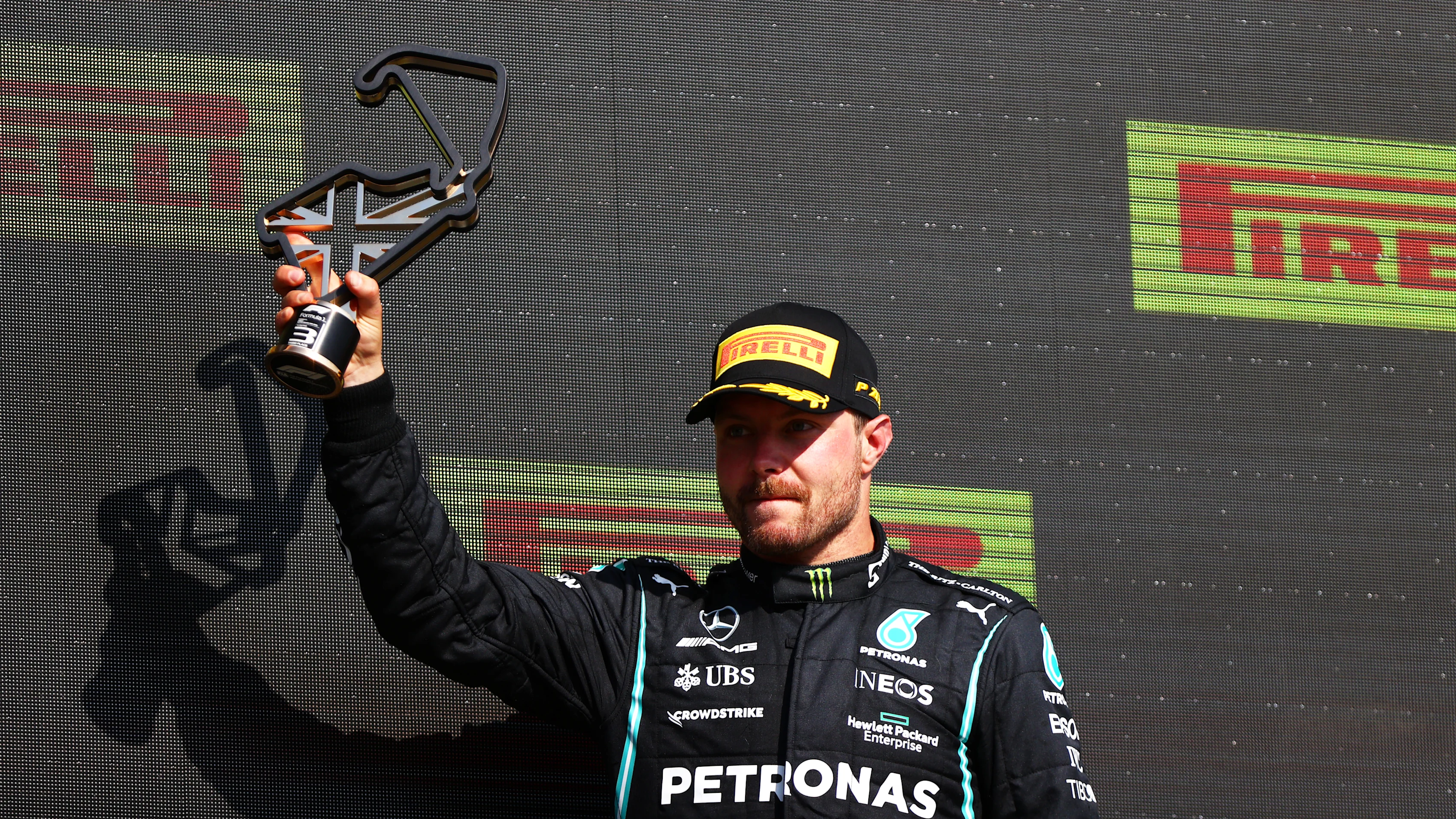 NORTHAMPTON, ENGLAND - JULY 18: Third placed Valtteri Bottas of Finland and Mercedes GP celebrates