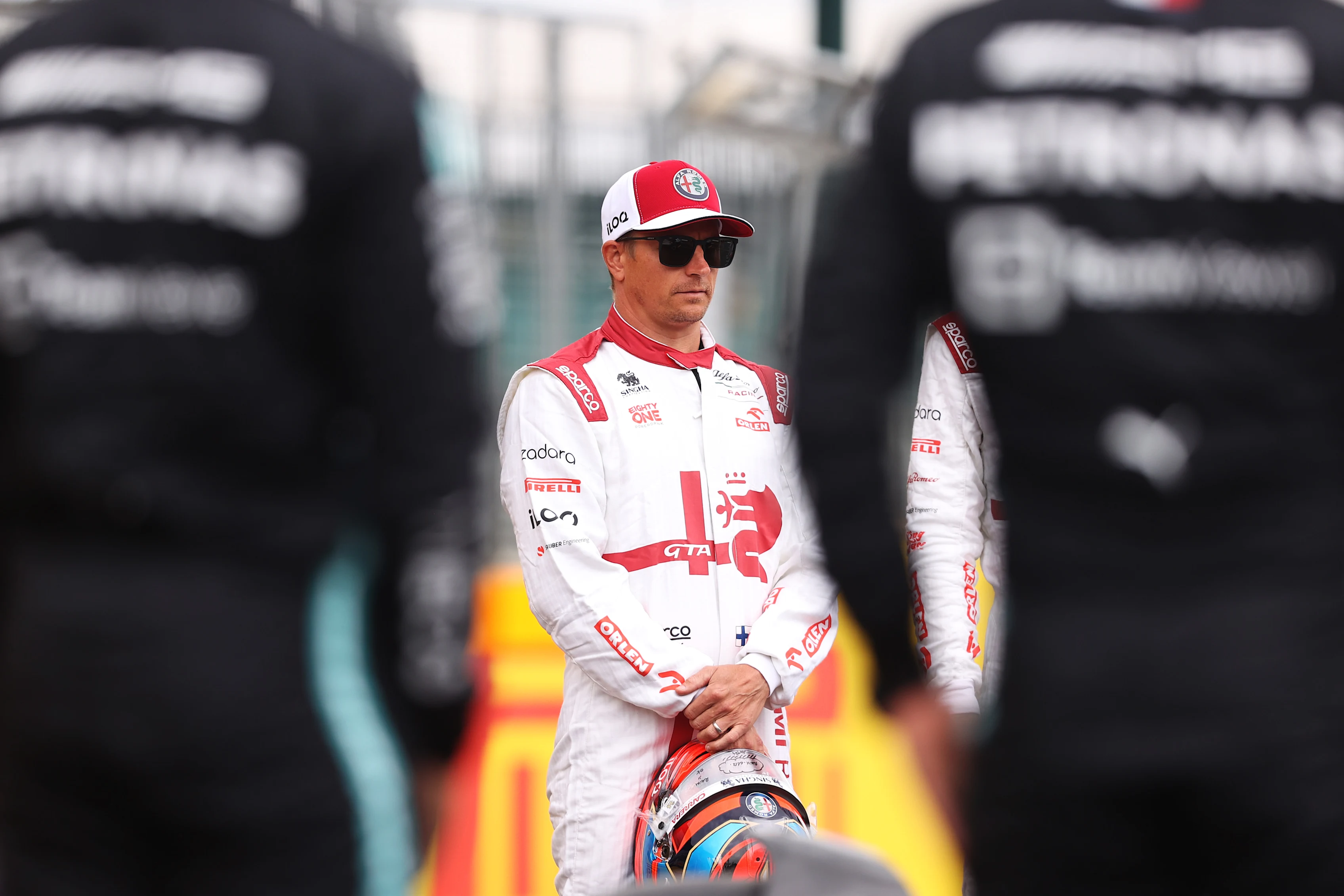 NORTHAMPTON, ENGLAND - JULY 15: Kimi Raikkonen of Finland and Alfa Romeo Racing looks on as the