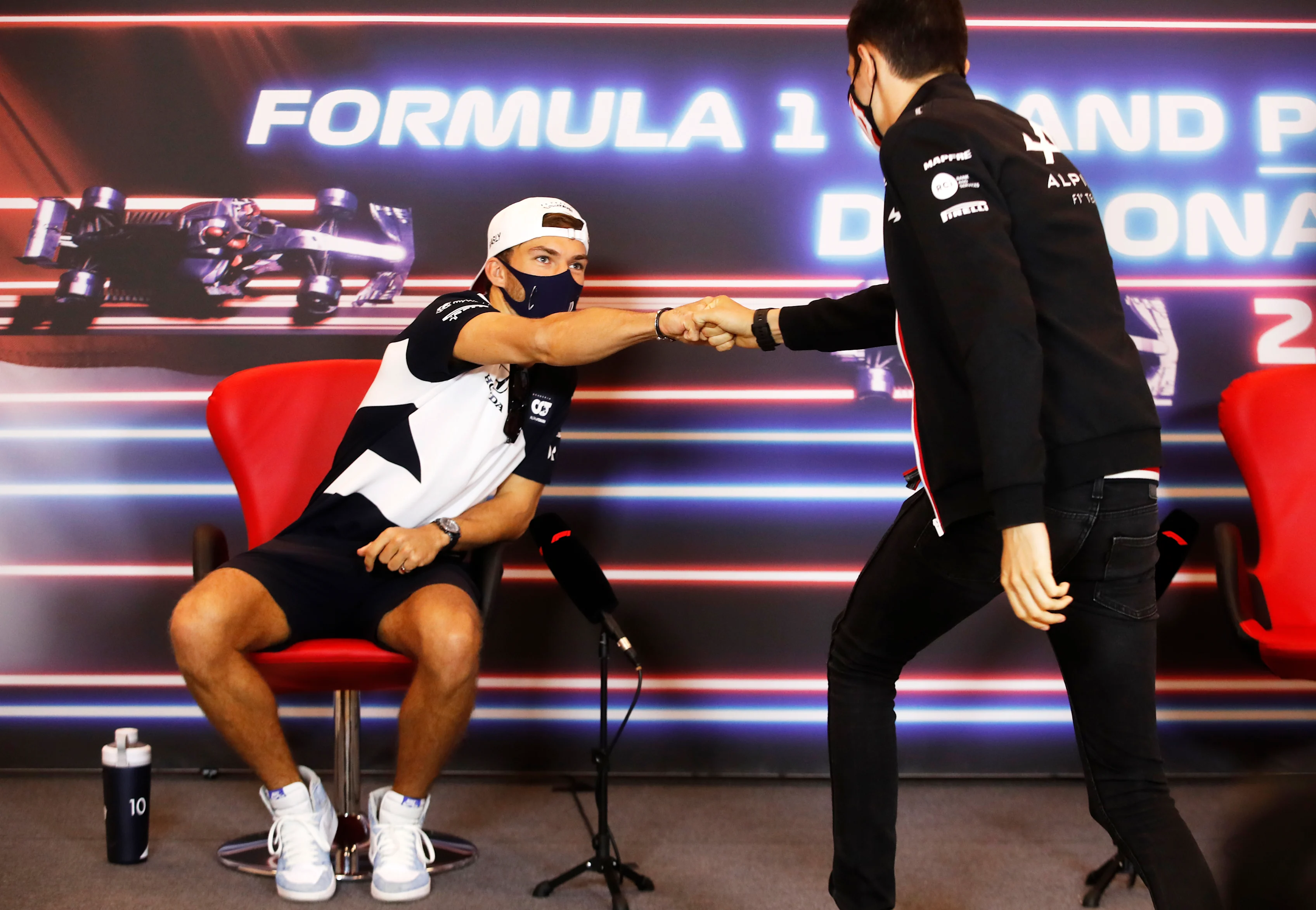 MONTE-CARLO, MONACO - MAY 19: Pierre Gasly of France and Scuderia AlphaTauri interacts with Esteban