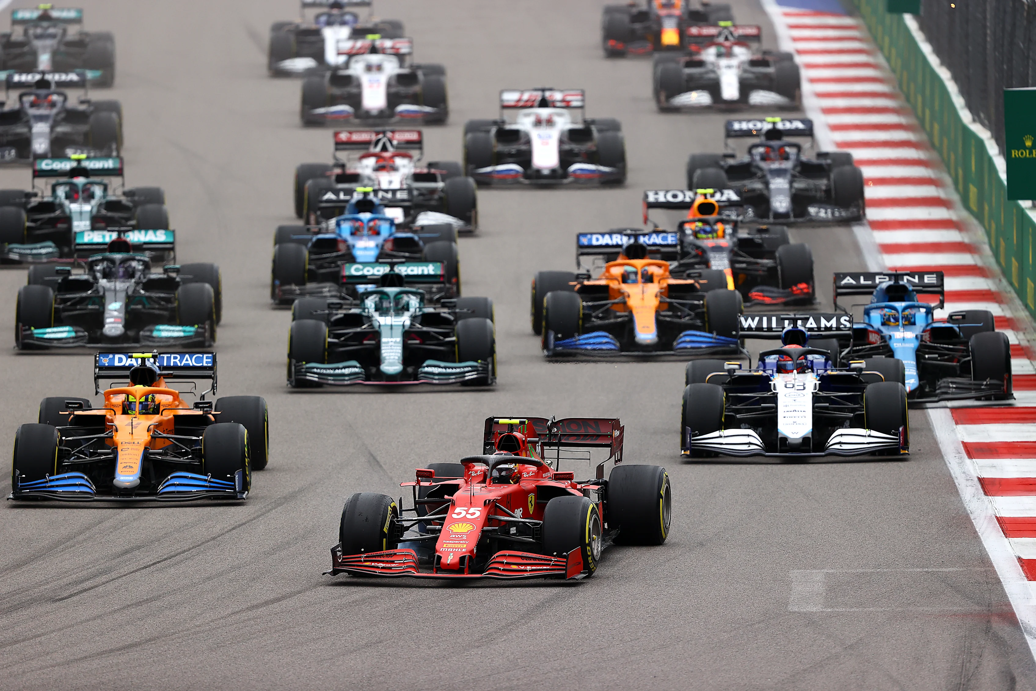SOCHI, RUSSIA - SEPTEMBER 26: Carlos Sainz of Spain driving the (55) Scuderia Ferrari SF21 leads