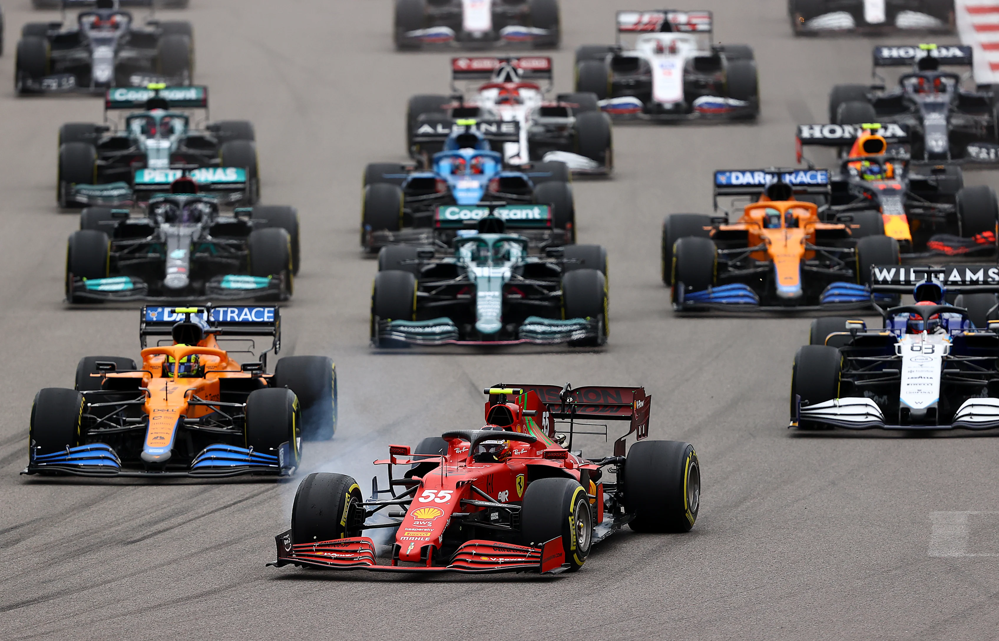 SOCHI, RUSSIA - SEPTEMBER 26: Carlos Sainz of Spain driving the (55) Scuderia Ferrari SF21 leads
