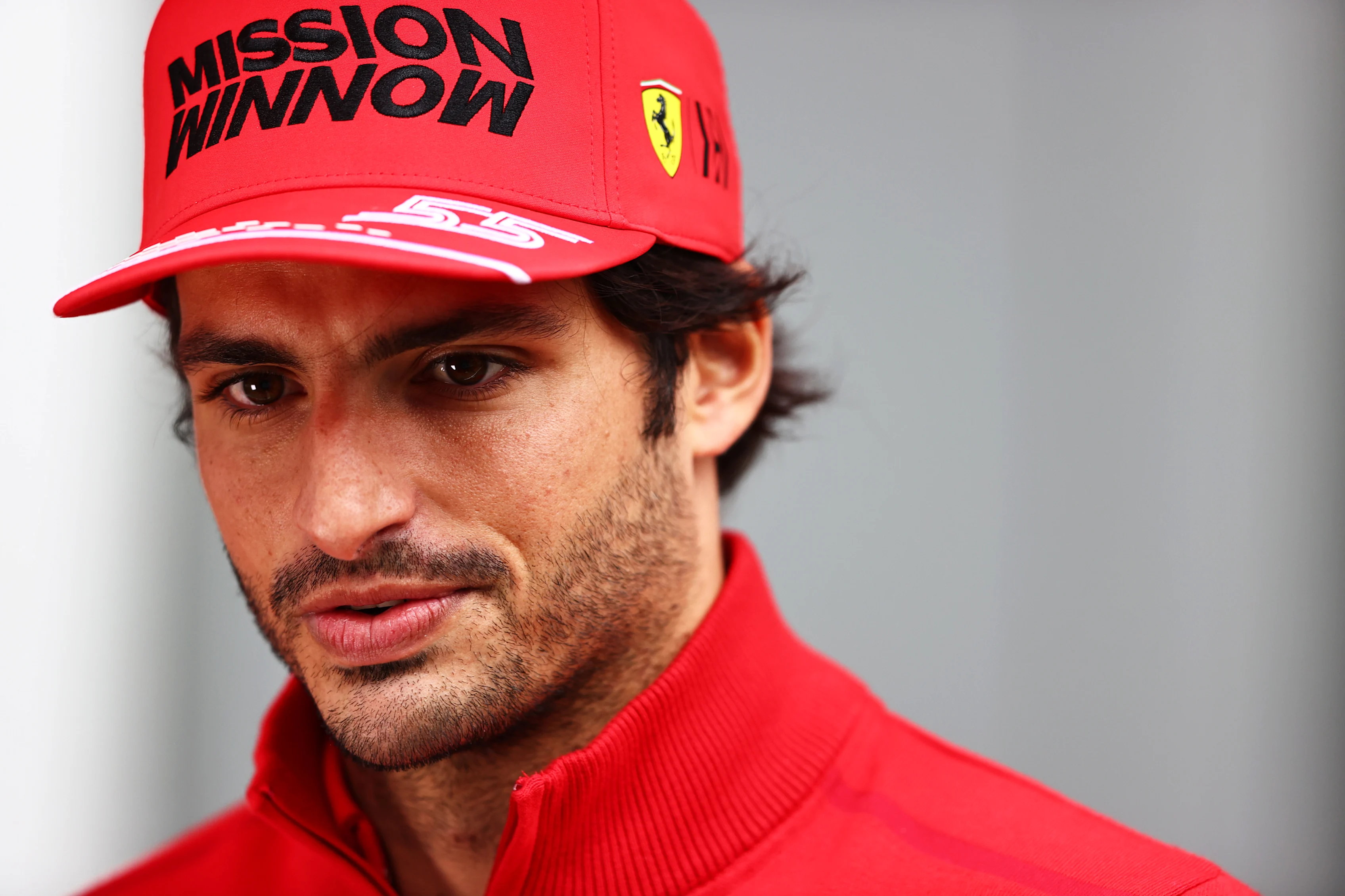 SOCHI, RUSSIA - SEPTEMBER 23: Carlos Sainz of Spain and Ferrari looks on in the Paddock during