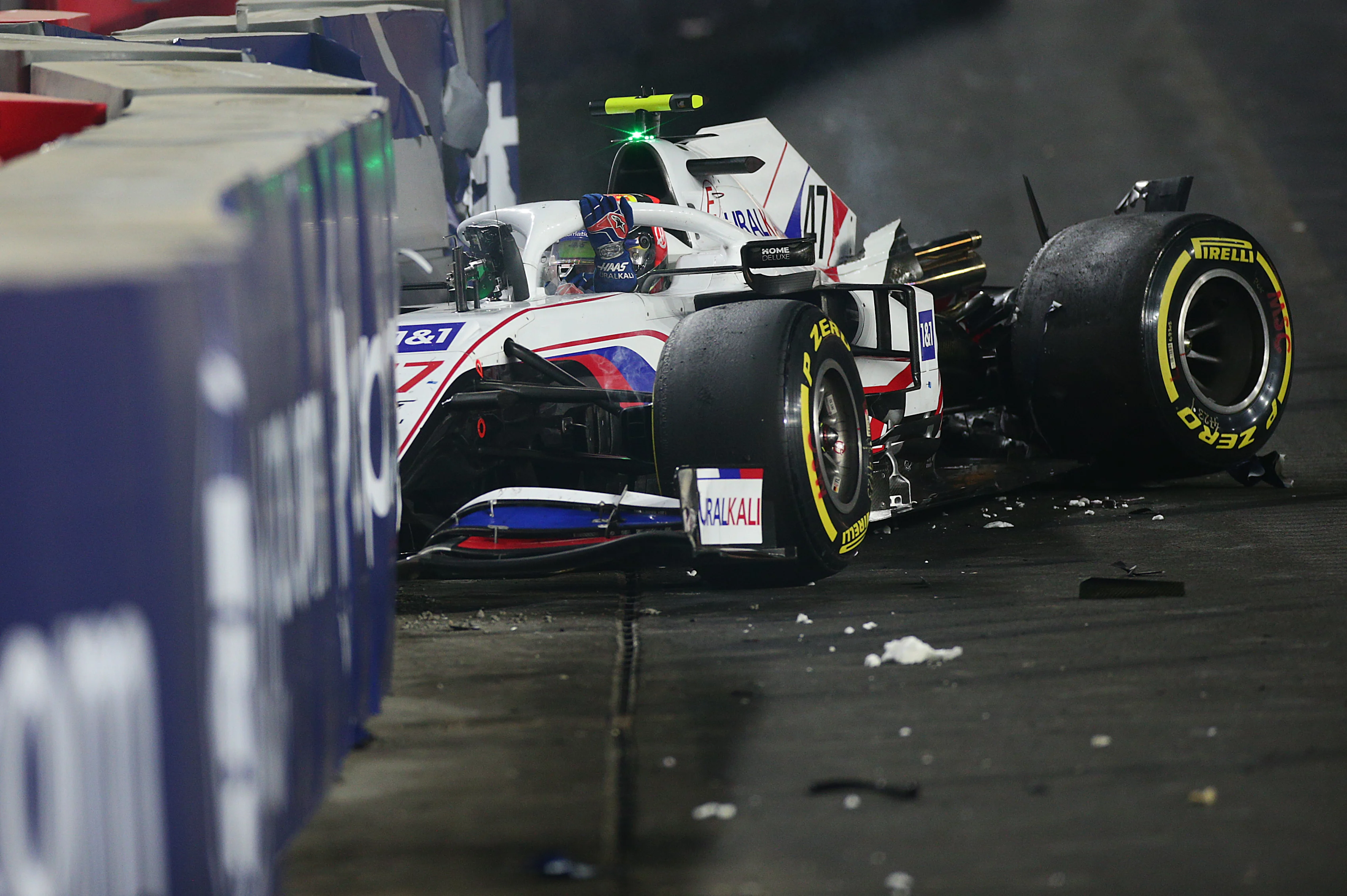 JEDDAH, SAUDI ARABIA - DECEMBER 05: Mick Schumacher of Germany driving the (47) Haas F1 Team VF-21 Ferrari crashes during the F1 Grand Prix of Saudi Arabia at Jeddah Corniche Circuit on December 05, 2021 in Jeddah, Saudi Arabia. (Photo by Peter Fox/Getty Images)
