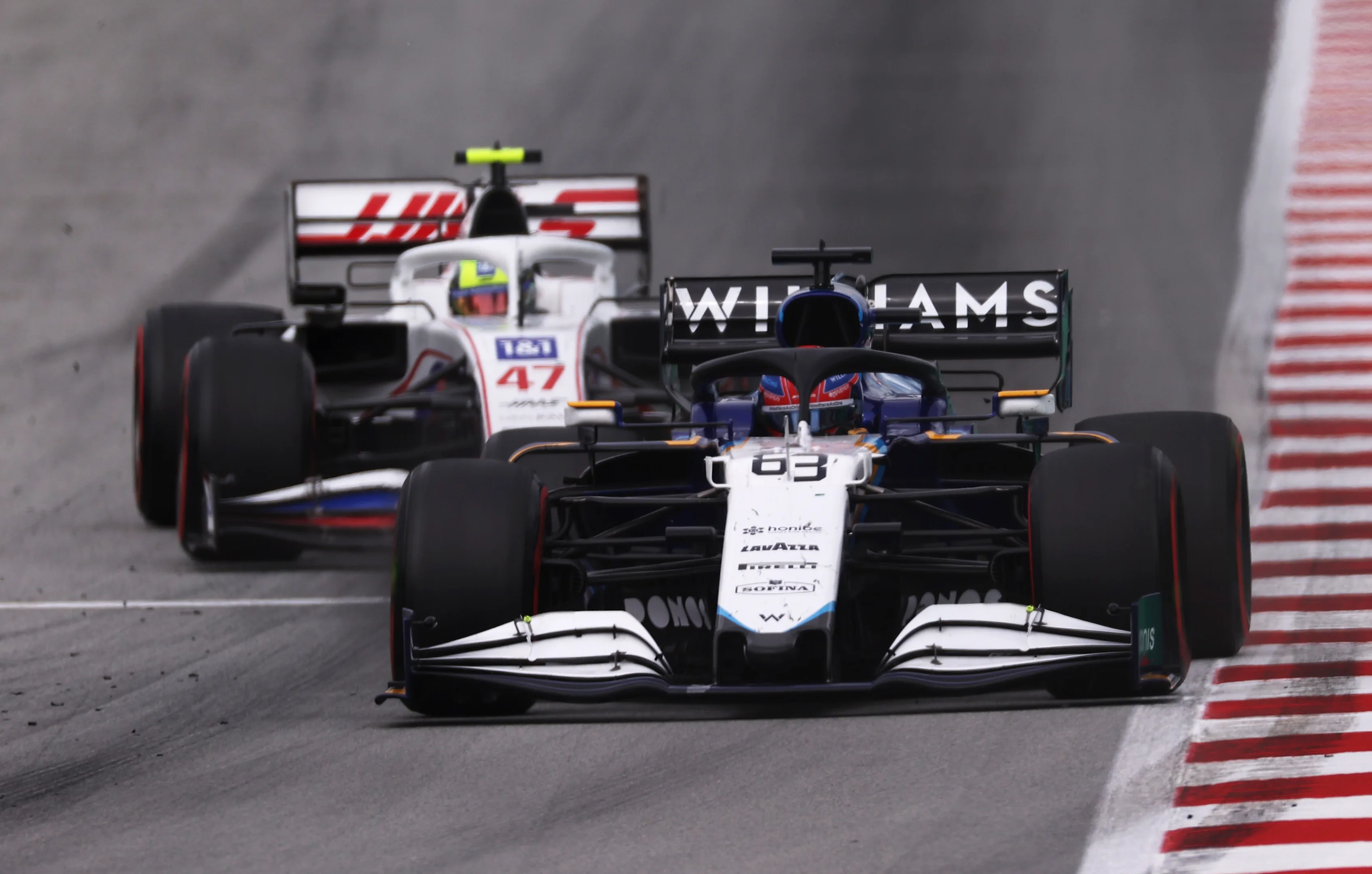 BARCELONA, SPAIN - MAY 09: George Russell of Great Britain driving the (63) Williams Racing FW43B Mercedes leads Mick Schumacher of Germany driving the (47) Haas F1 Team VF-21 Ferrari on track during the F1 Grand Prix of Spain at Circuit de Barcelona-Catalunya on May 09, 2021 in Barcelona, Spain. (Photo by Lars Baron/Getty Images)