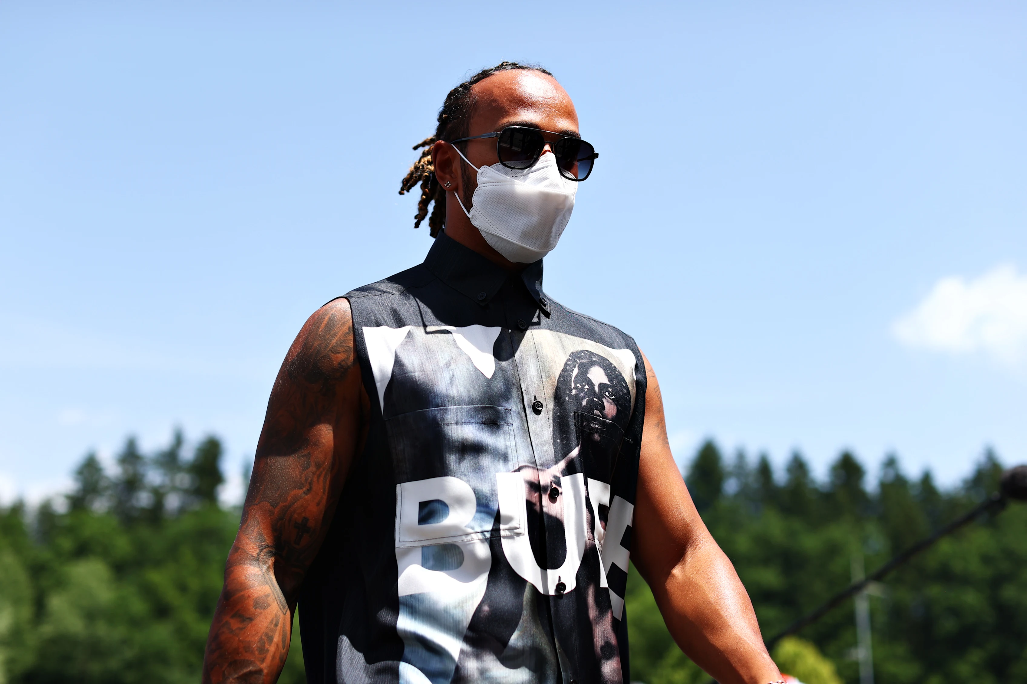 SPIELBERG, AUSTRIA - JUNE 24: Lewis Hamilton of Great Britain and Mercedes GP walks in the Paddock