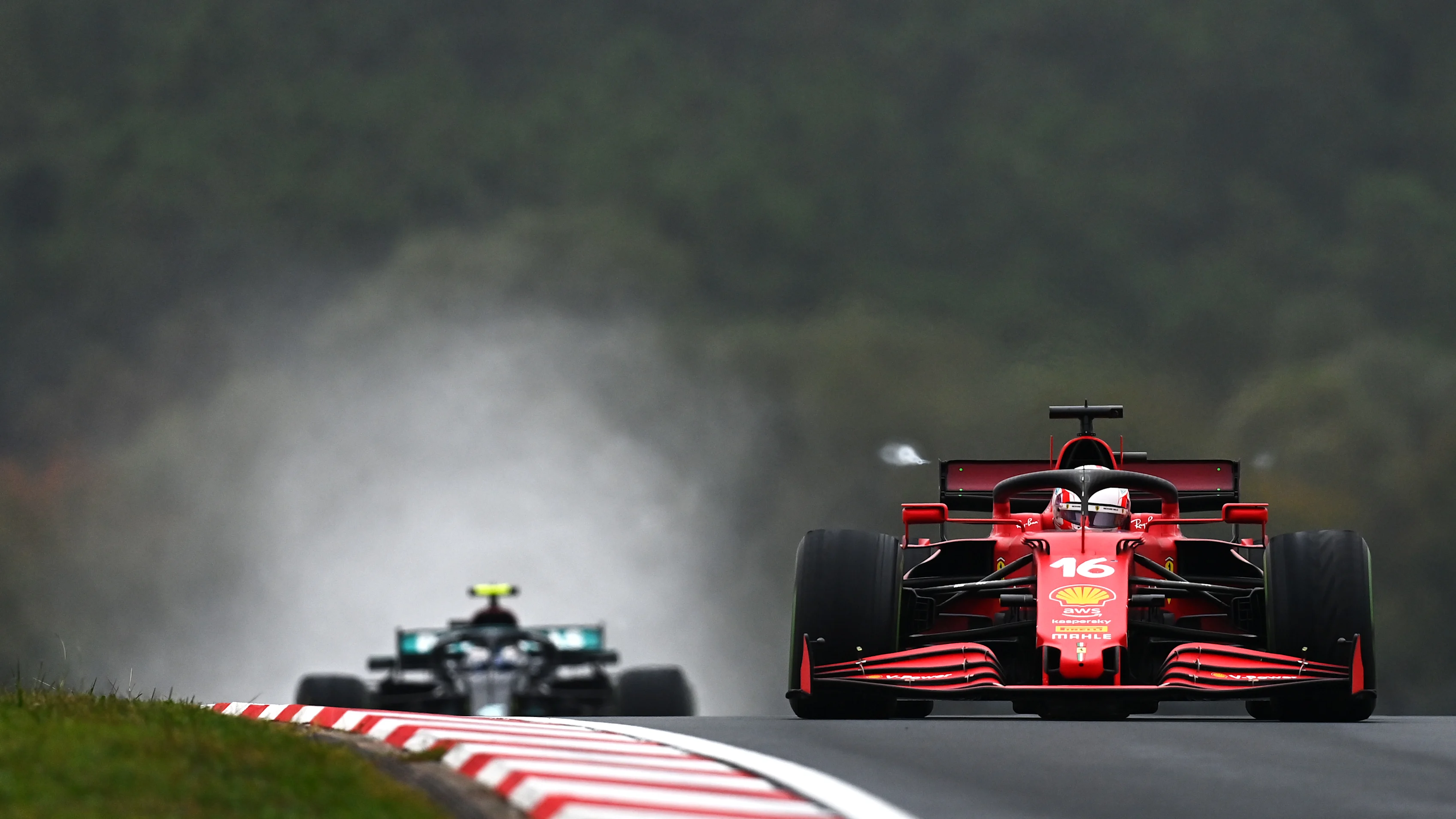 ISTANBUL, TURKEY - OCTOBER 10: Charles Leclerc of Monaco driving the (16) Scuderia Ferrari SF21 leads Valtteri Bottas of Finland driving the (77) Mercedes AMG Petronas F1 Team Mercedes W12 during the F1 Grand Prix of Turkey at Intercity Istanbul Park on October 10, 2021 in Istanbul, Turkey. (Photo by Clive Mason - Formula 1/Formula 1 via Getty Images)