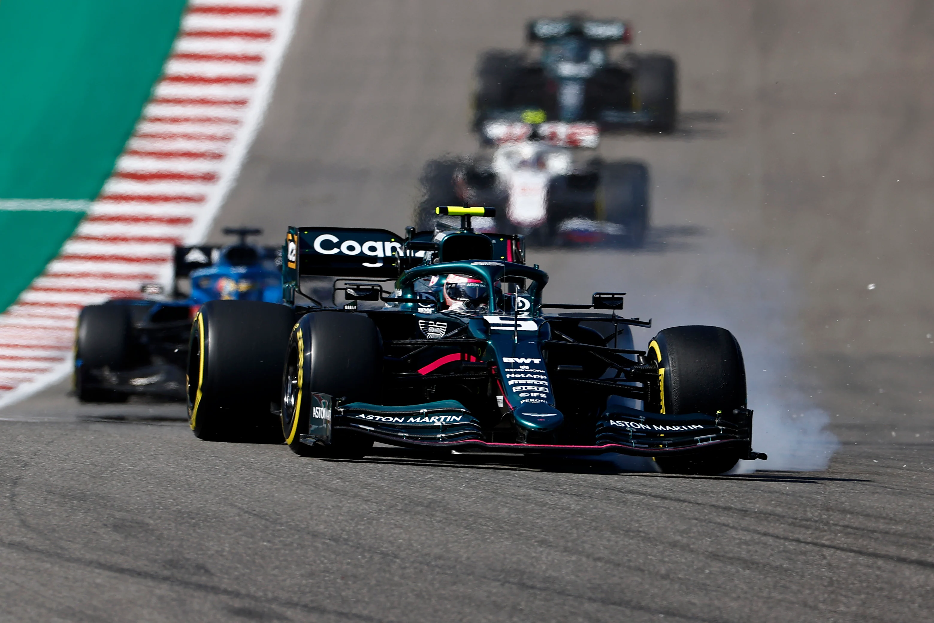 AUSTIN, TEXAS - OCTOBER 24: Sebastian Vettel of Germany driving the (5) Aston Martin AMR21 Mercedes locks a wheel under braking during the F1 Grand Prix of USA at Circuit of The Americas on October 24, 2021 in Austin, Texas. (Photo by Jared C. Tilton/Getty Images)