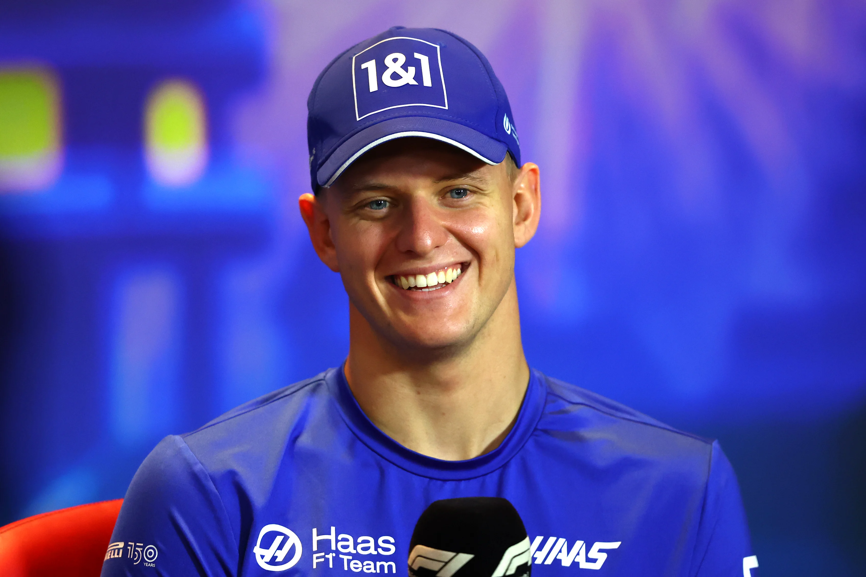 ABU DHABI, UNITED ARAB EMIRATES - NOVEMBER 17: Mick Schumacher of Germany and Haas F1 talks in a