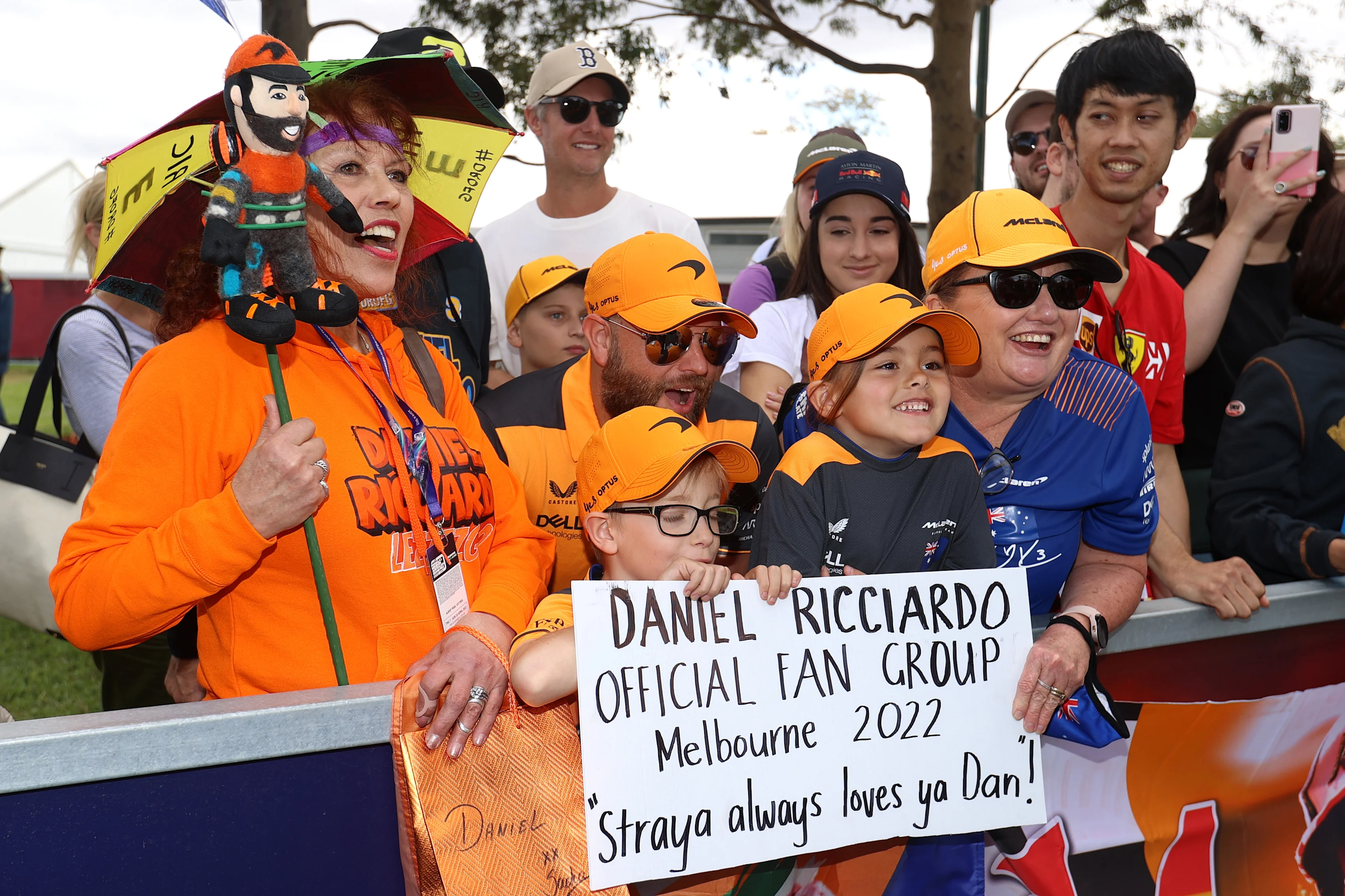MELBOURNE, AUSTRALIA - APRIL 07: Fans of Daniel Ricciardo of Australia and McLaren hold a sign to