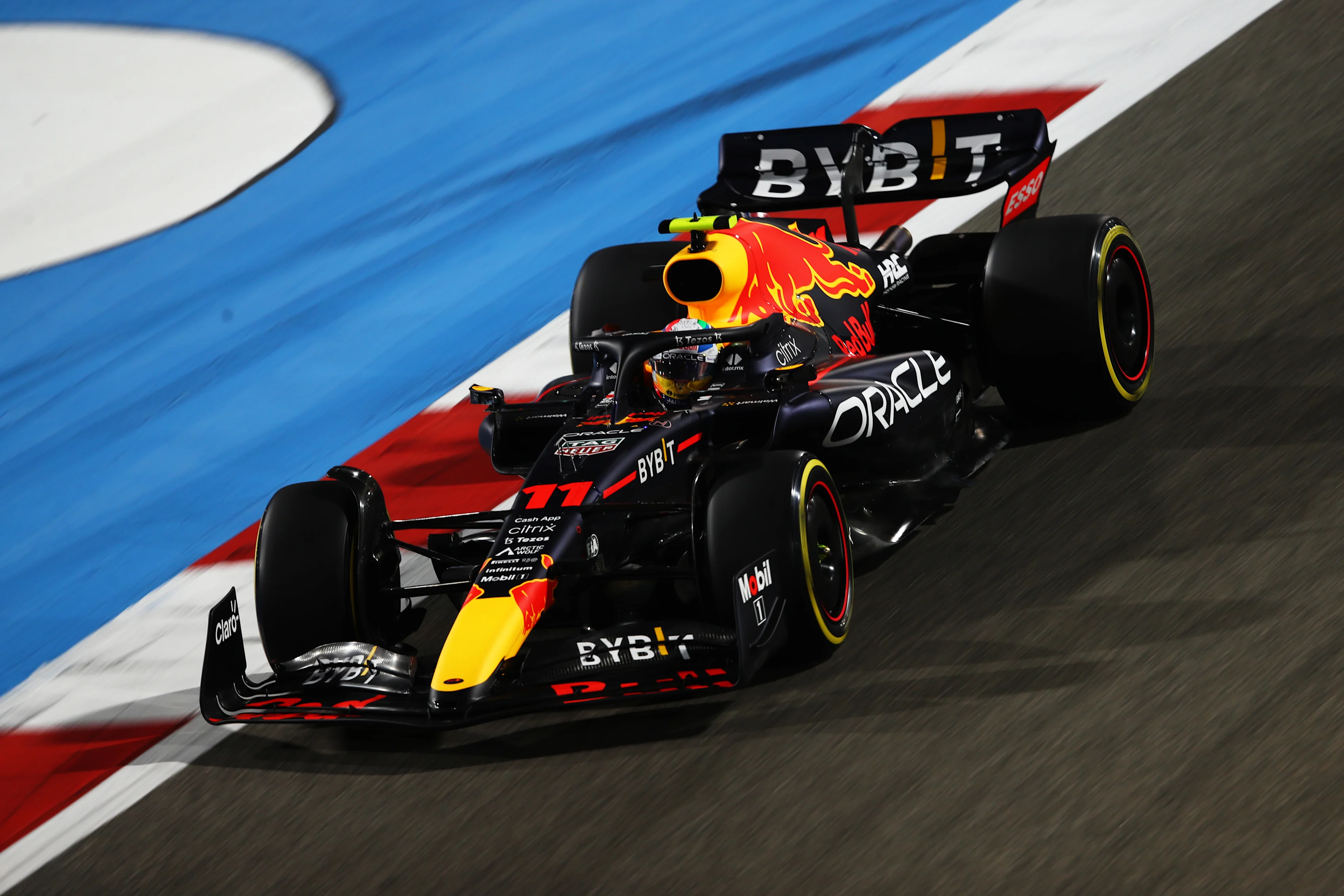 BAHRAIN, BAHRAIN - MARCH 18: Sergio Perez of Mexico driving the (11) Oracle Red Bull Racing RB18 on track  during practice ahead of the F1 Grand Prix of Bahrain at Bahrain International Circuit on March 18, 2022 in Bahrain, Bahrain. (Photo by Joe Portlock - Formula 1/Formula 1 via Getty Images)