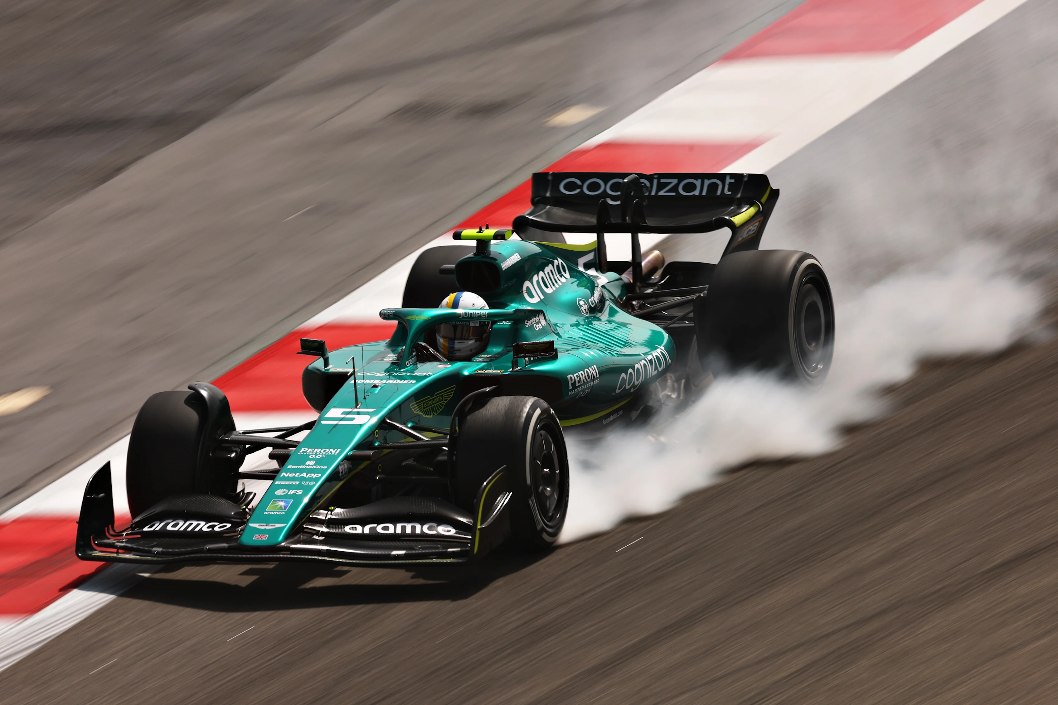BAHRAIN, BAHRAIN - MARCH 11: Sebastian Vettel of Germany driving the (5) Aston Martin AMR22 Mercedes locks a wheel under braking during Day Two of F1 Testing at Bahrain International Circuit on March 11, 2022 in Bahrain, Bahrain. (Photo by Lars Baron/Getty Images)