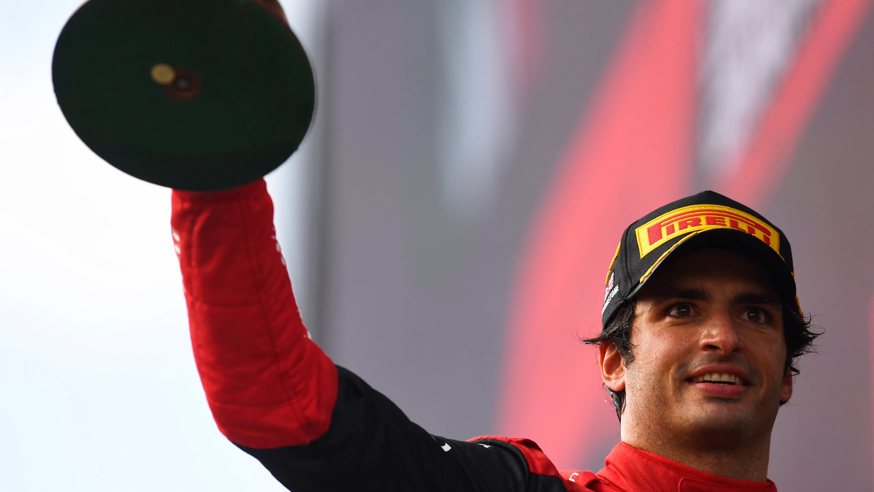 NORTHAMPTON, ENGLAND - JULY 03: Race winner Carlos Sainz of Spain and Ferrari celebrates on the