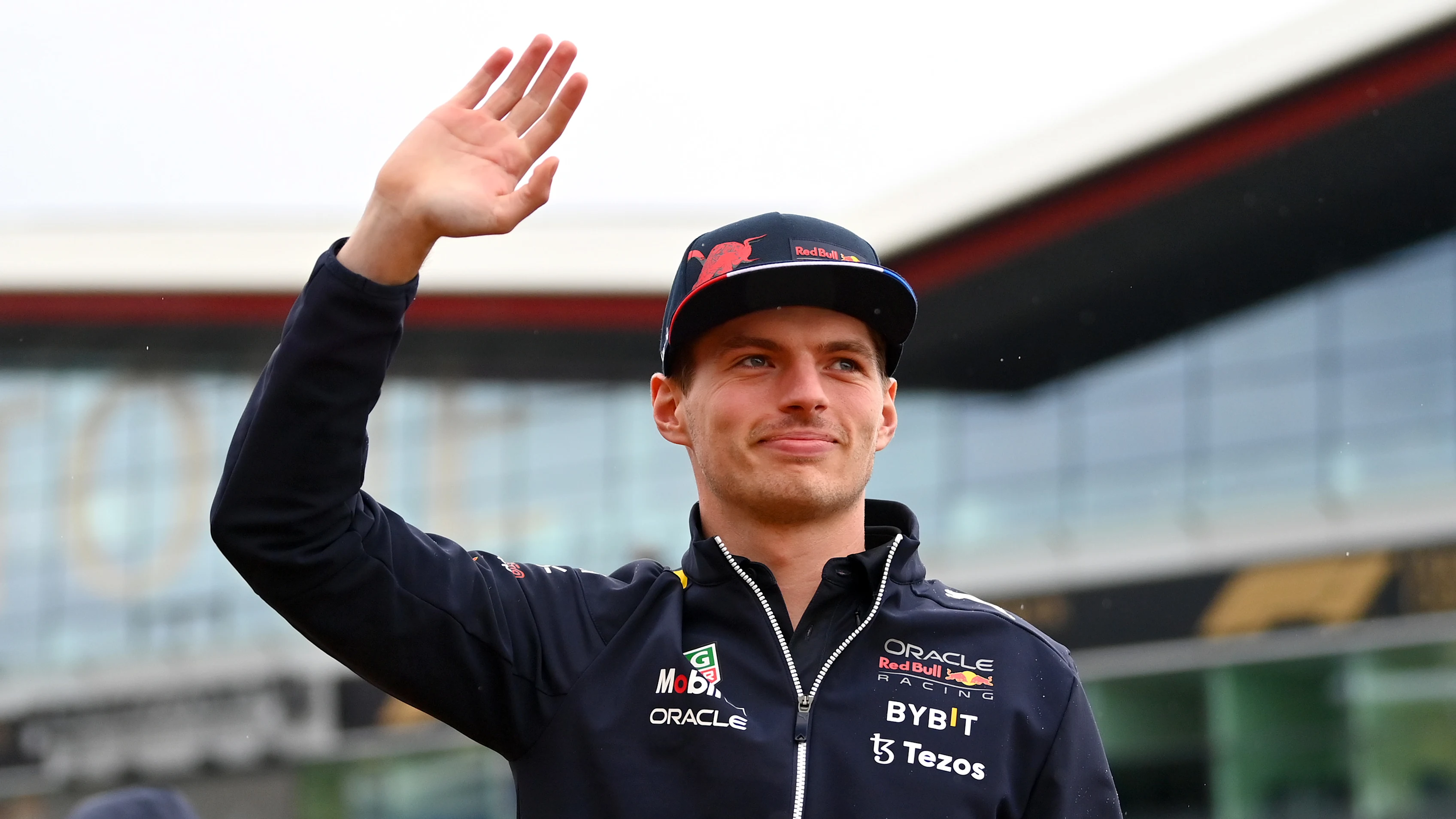 NORTHAMPTON, ENGLAND - JUNE 30: Max Verstappen of the Netherlands and Oracle Red Bull Racing waves