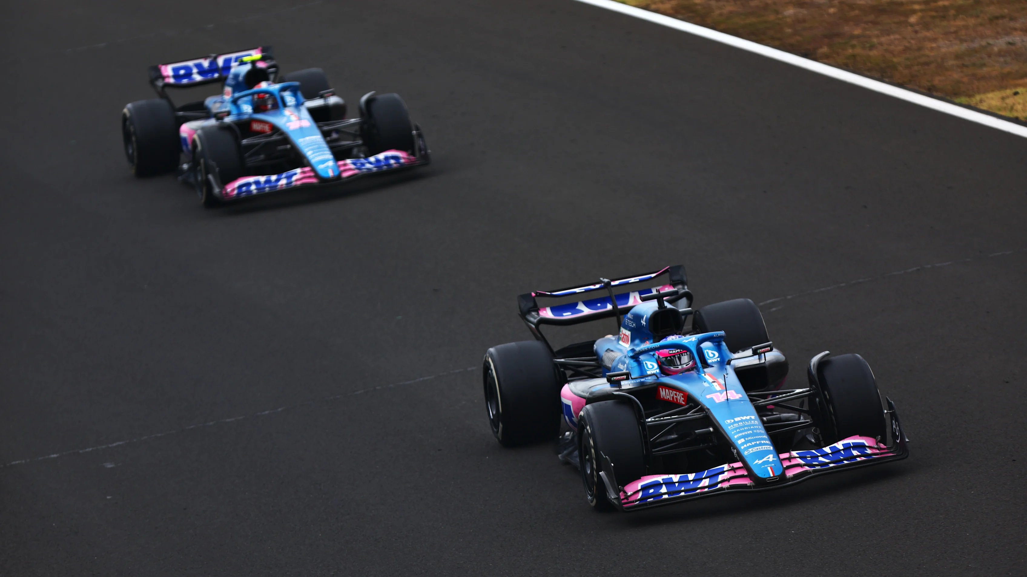 BUDAPEST, HUNGARY - JULY 31: Fernando Alonso of Spain driving the (14) Alpine F1 A522 Renault leads