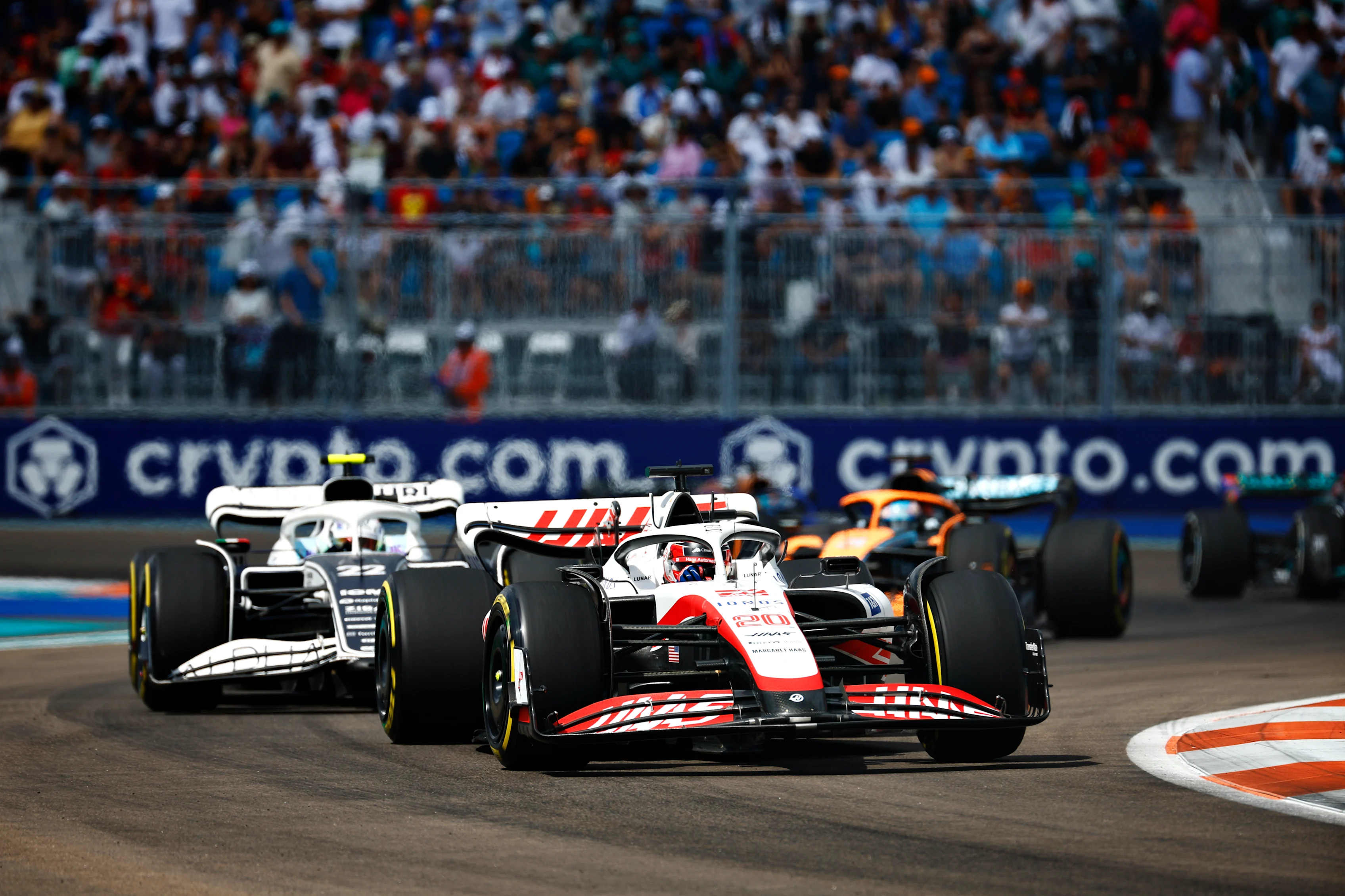 MIAMI, FLORIDA - MAY 08: Kevin Magnussen of Denmark driving the (20) Haas F1 VF-22 Ferrari leads Yuki Tsunoda of Japan driving the (22) Scuderia AlphaTauri AT03 during the F1 Grand Prix of Miami at the Miami International Autodrome on May 08, 2022 in Miami, Florida. (Photo by Jared C. Tilton/Getty Images)