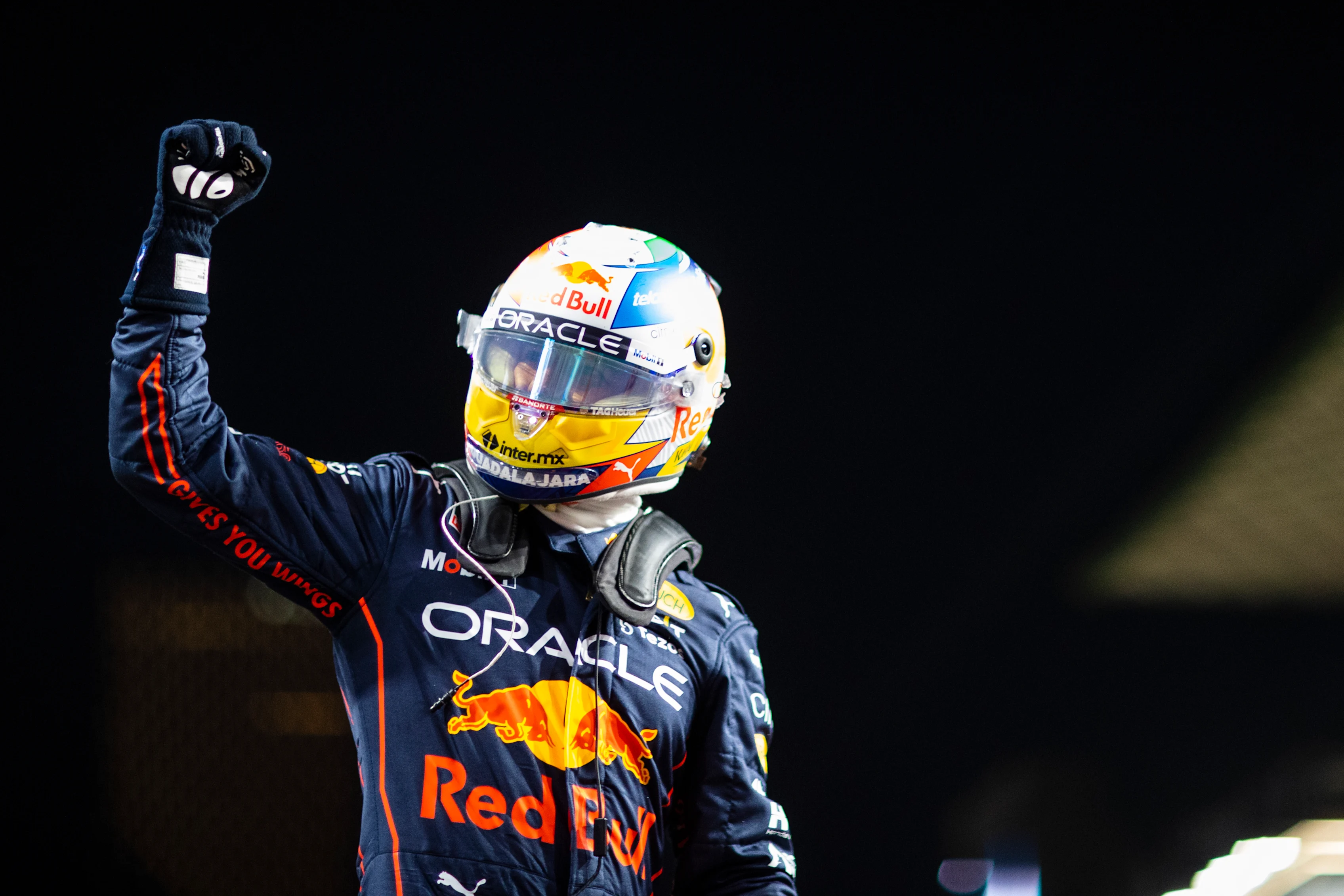JEDDAH, SAUDI ARABIA - MARCH 26: Pole position qualifier Sergio Perez of Mexico and Oracle Red Bull Racing celebrates in parc ferme during qualifying ahead of the F1 Grand Prix of Saudi Arabia at the Jeddah Corniche Circuit on March 26, 2022 in Jeddah, Saudi Arabia. (Photo by Dan Istitene - Formula 1/Formula 1 via Getty Images)
