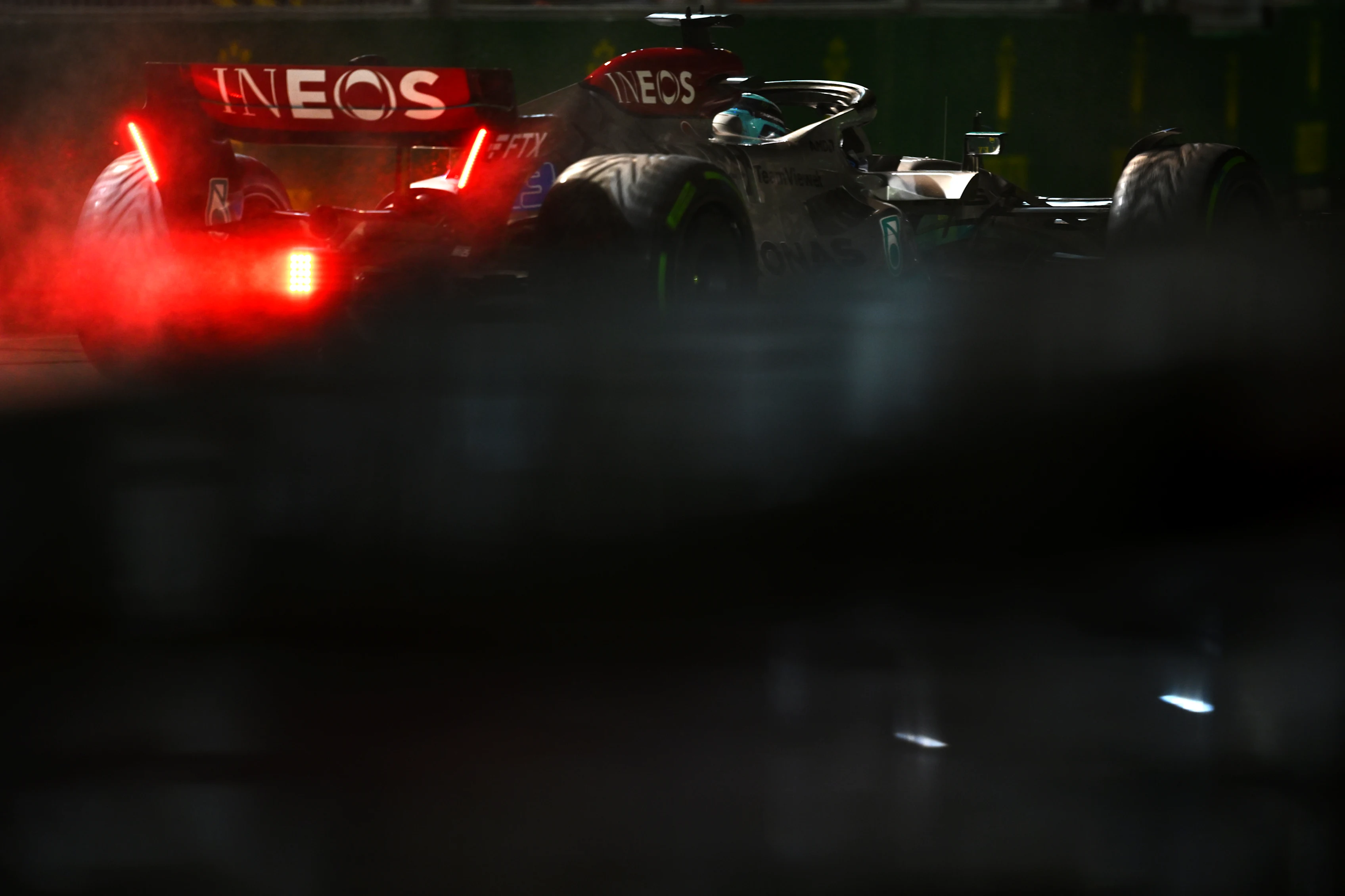 SINGAPORE, SINGAPORE - OCTOBER 02: George Russell of Great Britain driving the (63) Mercedes AMG Petronas F1 Team W13 on his way to the grid prior to the F1 Grand Prix of Singapore at Marina Bay Street Circuit on October 02, 2022 in Singapore, Singapore. (Photo by Clive Mason/Getty Images,)