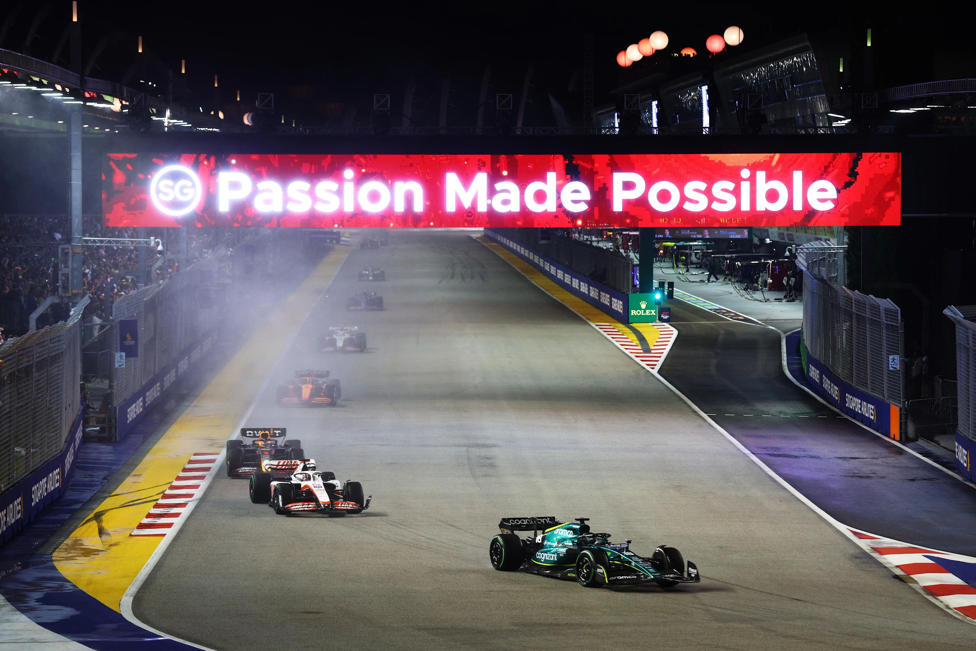SINGAPORE, SINGAPORE - OCTOBER 02: Lance Stroll of Canada driving the (18) Aston Martin AMR22
