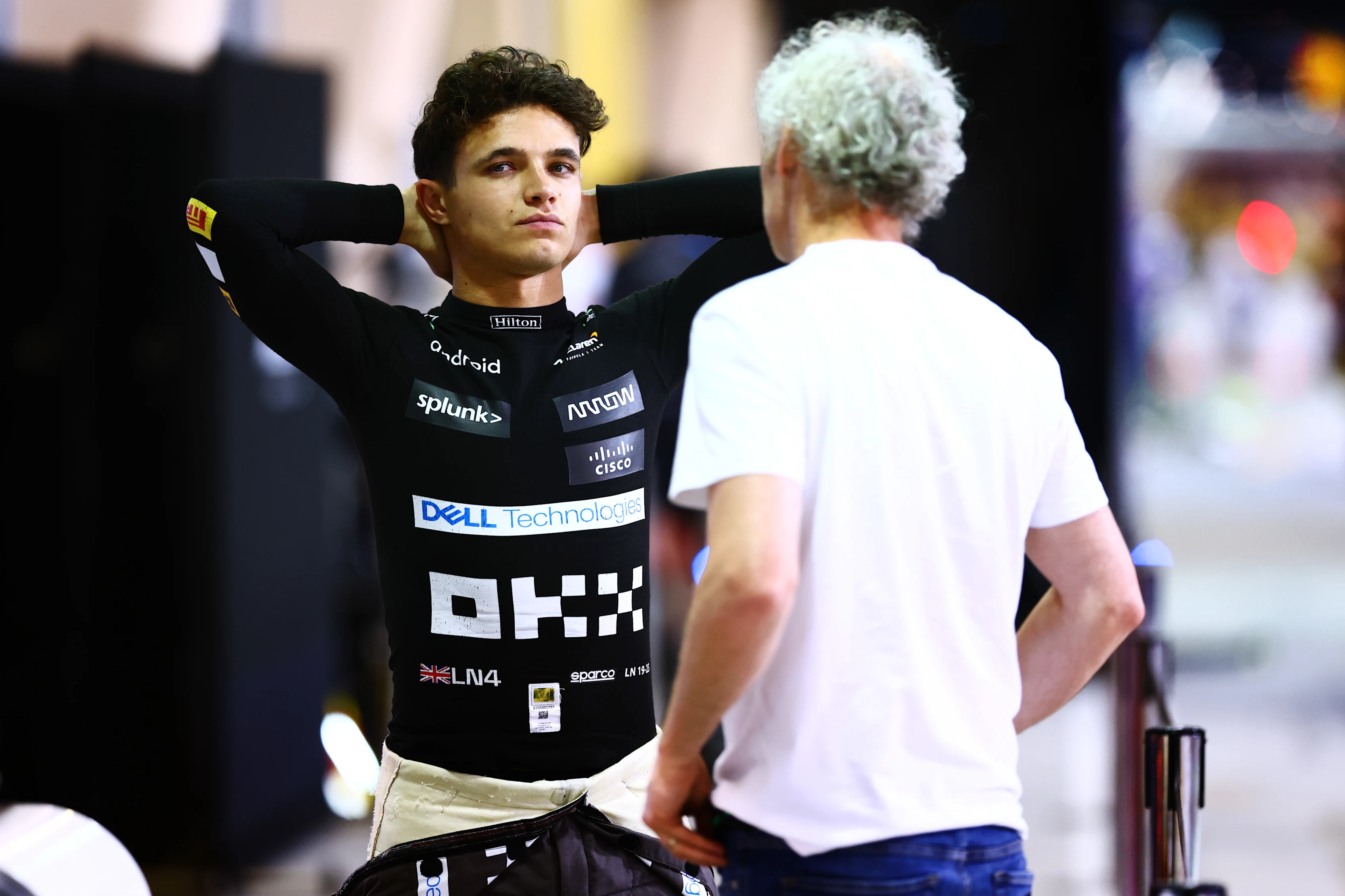 BAHRAIN, BAHRAIN - FEBRUARY 25: Lando Norris of Great Britain and McLaren speaks with his manager,