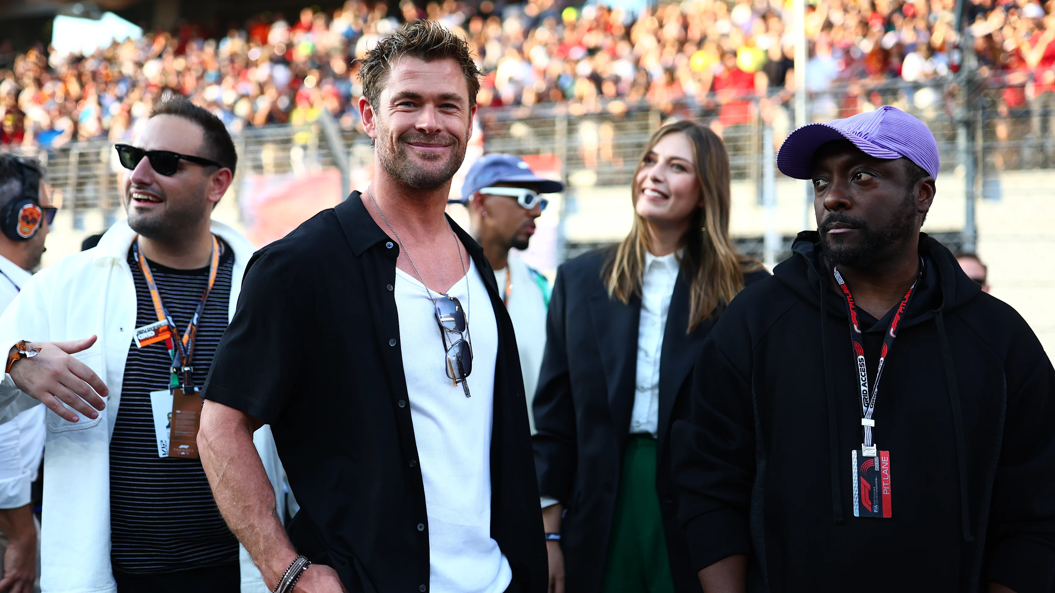 ABU DHABI, UNITED ARAB EMIRATES - NOVEMBER 26: Chris Hemsworth and will.i.am interact on the grid