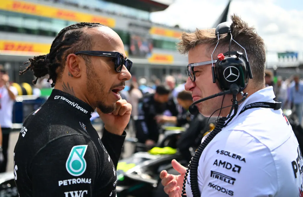 NORTHAMPTON, ENGLAND - JULY 09: Lewis Hamilton of Great Britain and Mercedes talks with race engineer Peter Bonnington on the grid during the F1 Grand Prix of Great Britain. (Photo by Dan Mullan/Getty Images)