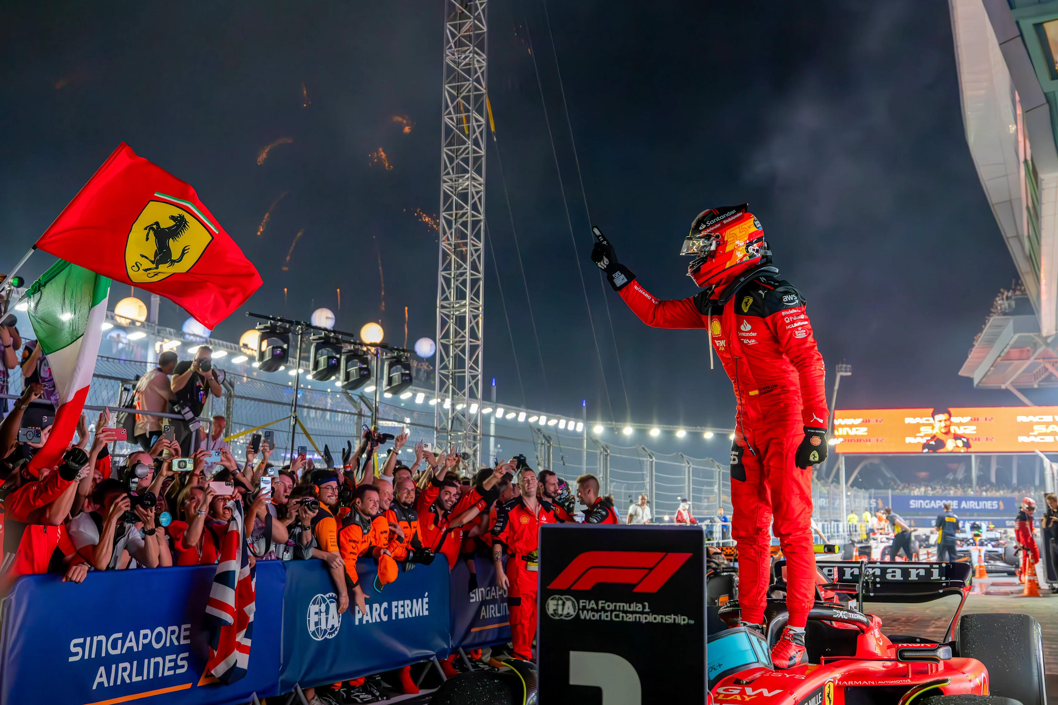 SINGAPORE, SINGAPORE - SEPTEMBER 17: Carlos Sainz Jr of Spain and Scuderia Ferrari celebrates his