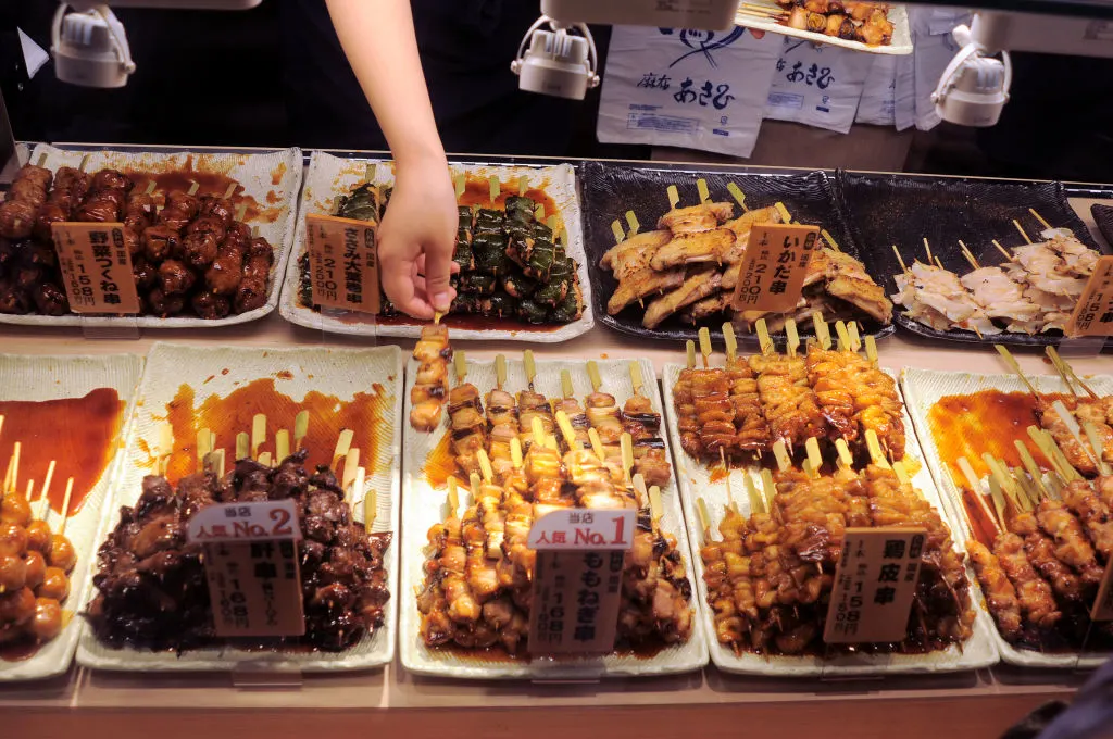 TOKYO, JAPAN - JANUARY 16, 2014: Sticks of grilled chicken (yakitori) for sale at a food store in