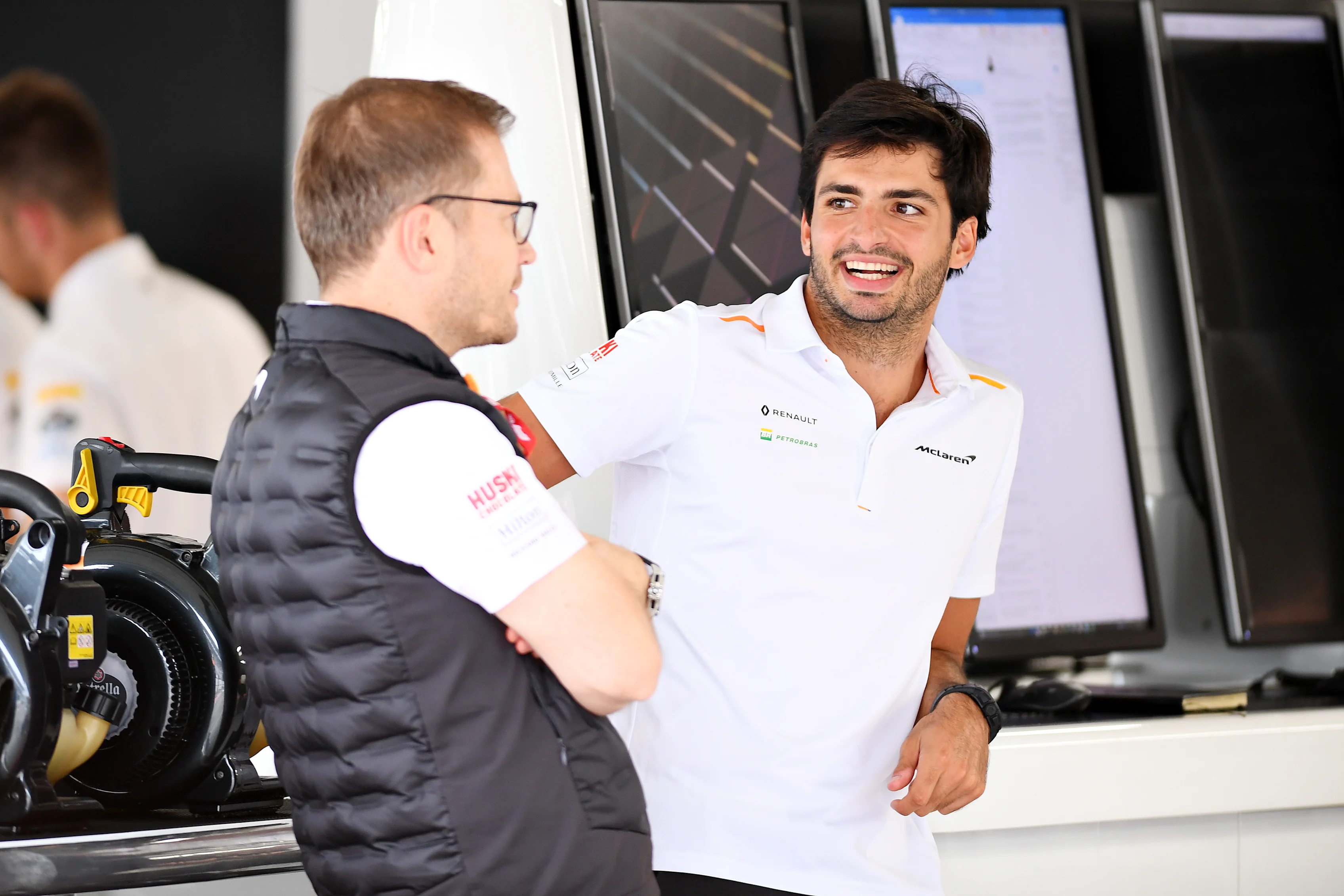 SUZUKA, JAPAN - OCTOBER 10: Carlos Sainz of Spain and McLaren F1 talks with McLaren Team Principal