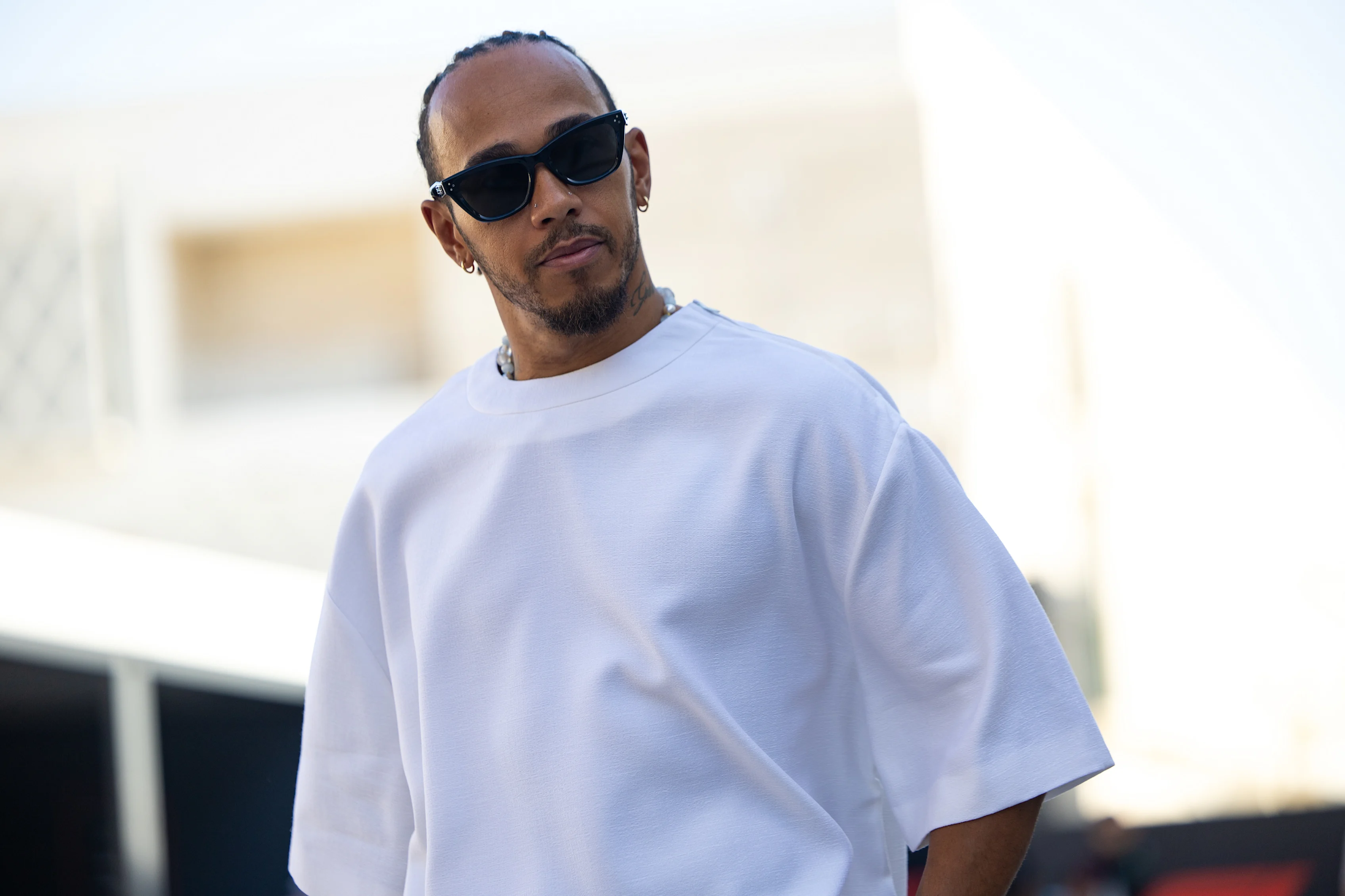 LUSAIL, QATAR - OCTOBER 7: Lewis Hamilton of Great Britain and Mercedes AMG walks in the paddock