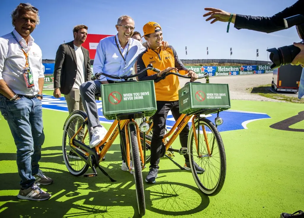 Formula One Group CEO Stefano Domenicali (L) and McLaren's British driver and Lando Norris pose as
