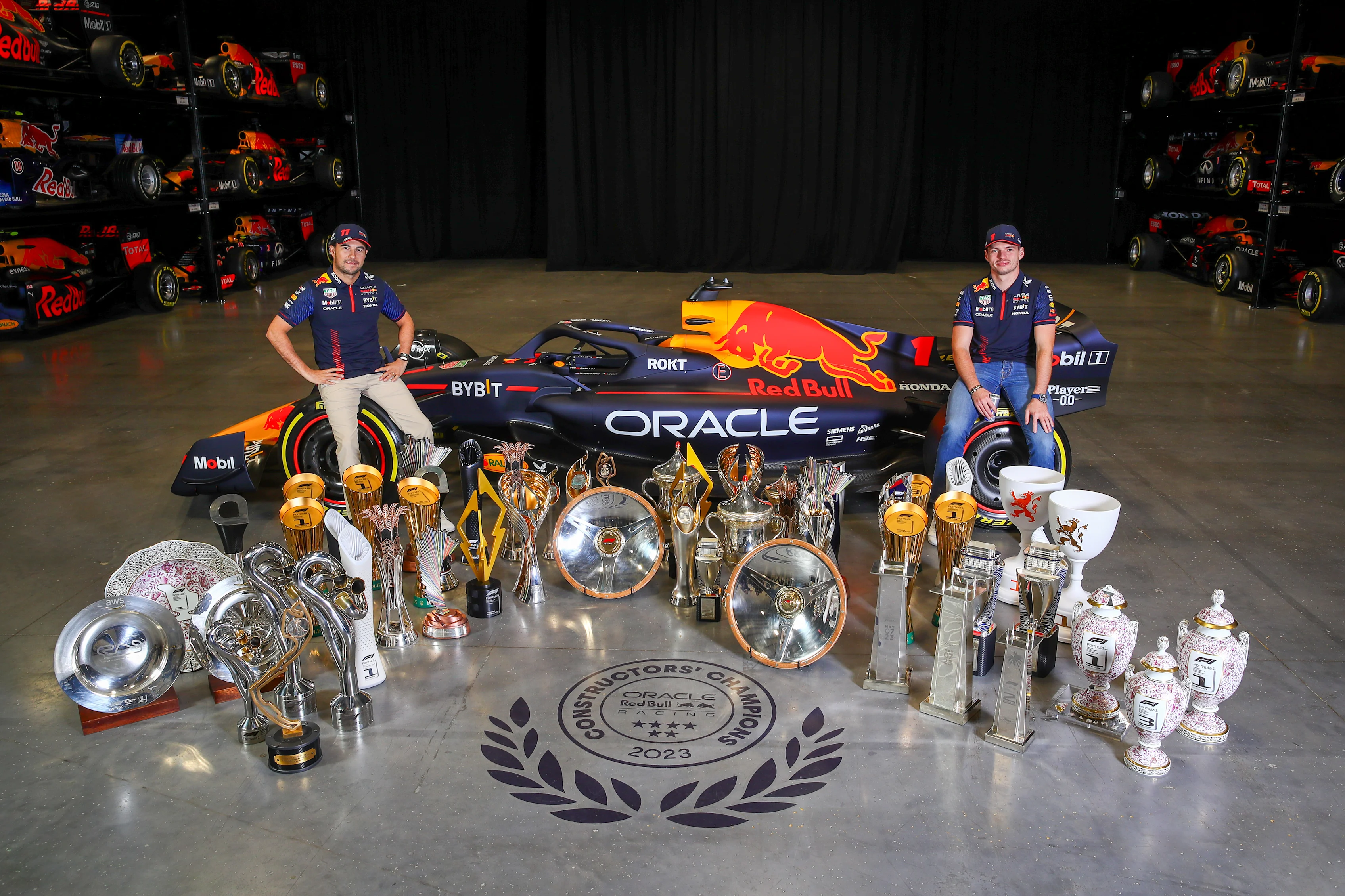 MILTON KEYNES, ENGLAND - DECEMBER 13: Sergio Perez of Mexico and Oracle Red Bull Racing (L) and Max
