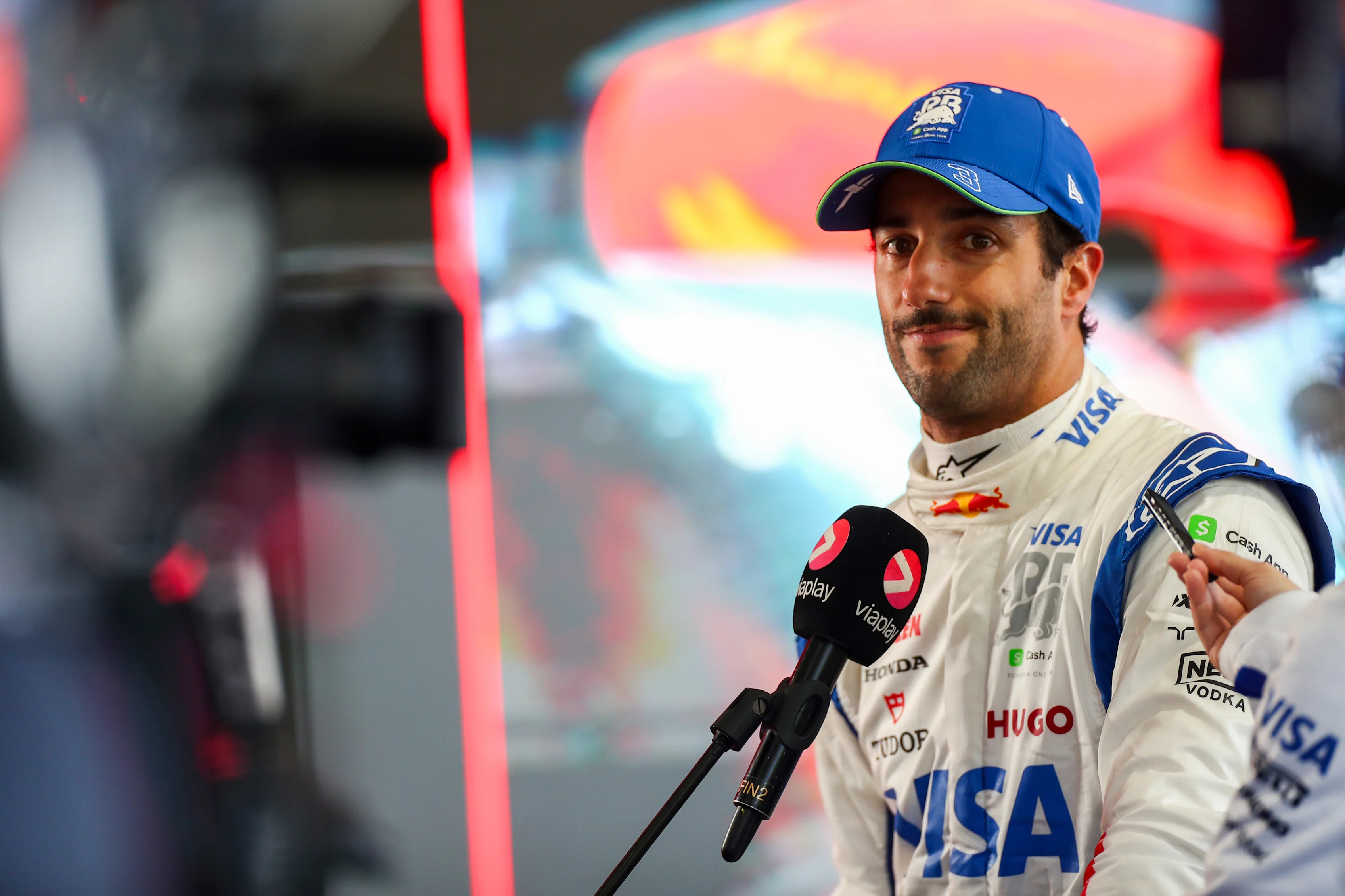 MELBOURNE, AUSTRALIA - MARCH 23: Daniel Ricciardo of Australia and Visa Cash App RB talks to the