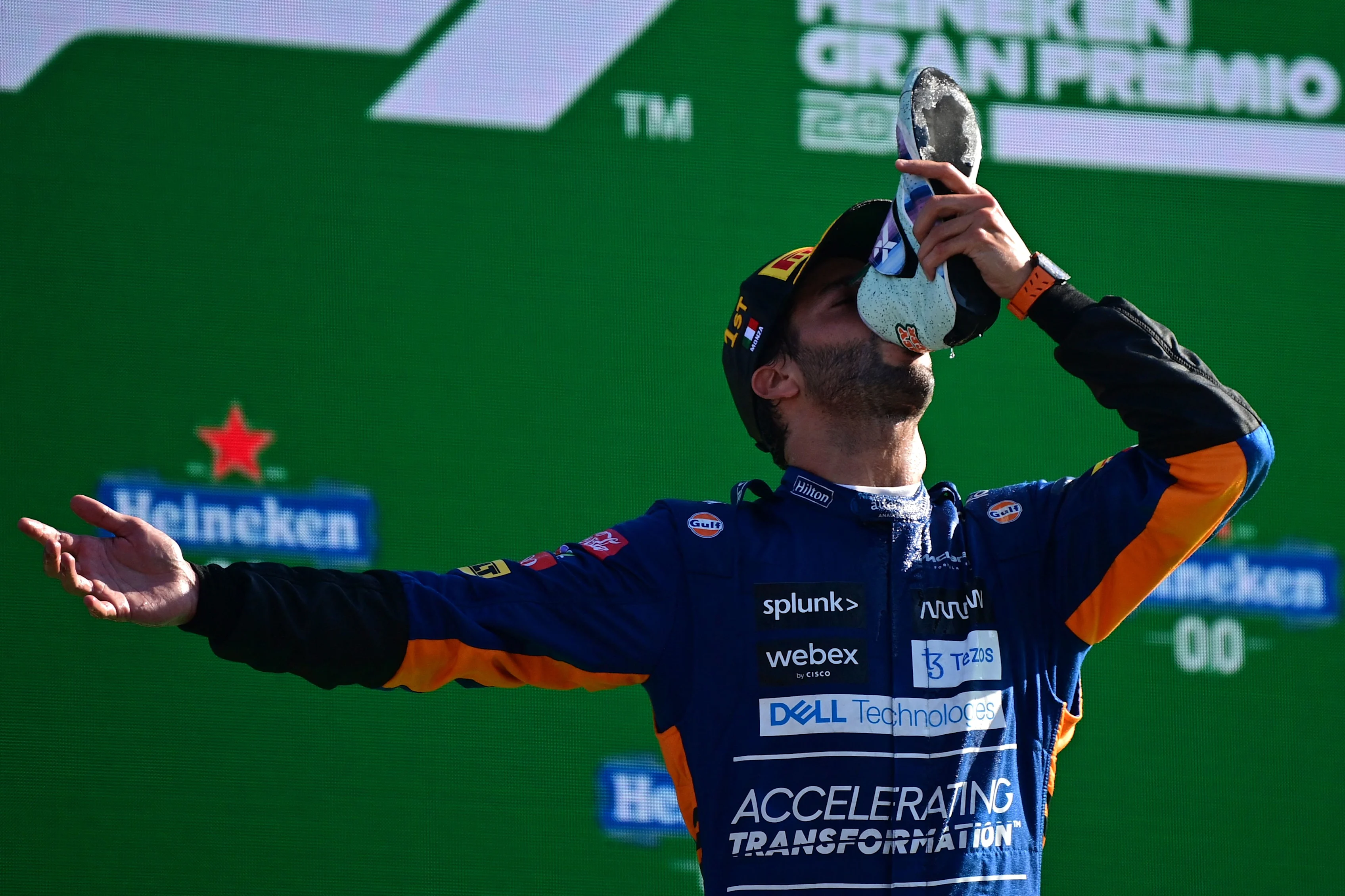 Winner McLaren's Australian driver Daniel Ricciardo celebrates on the podium after the Italian