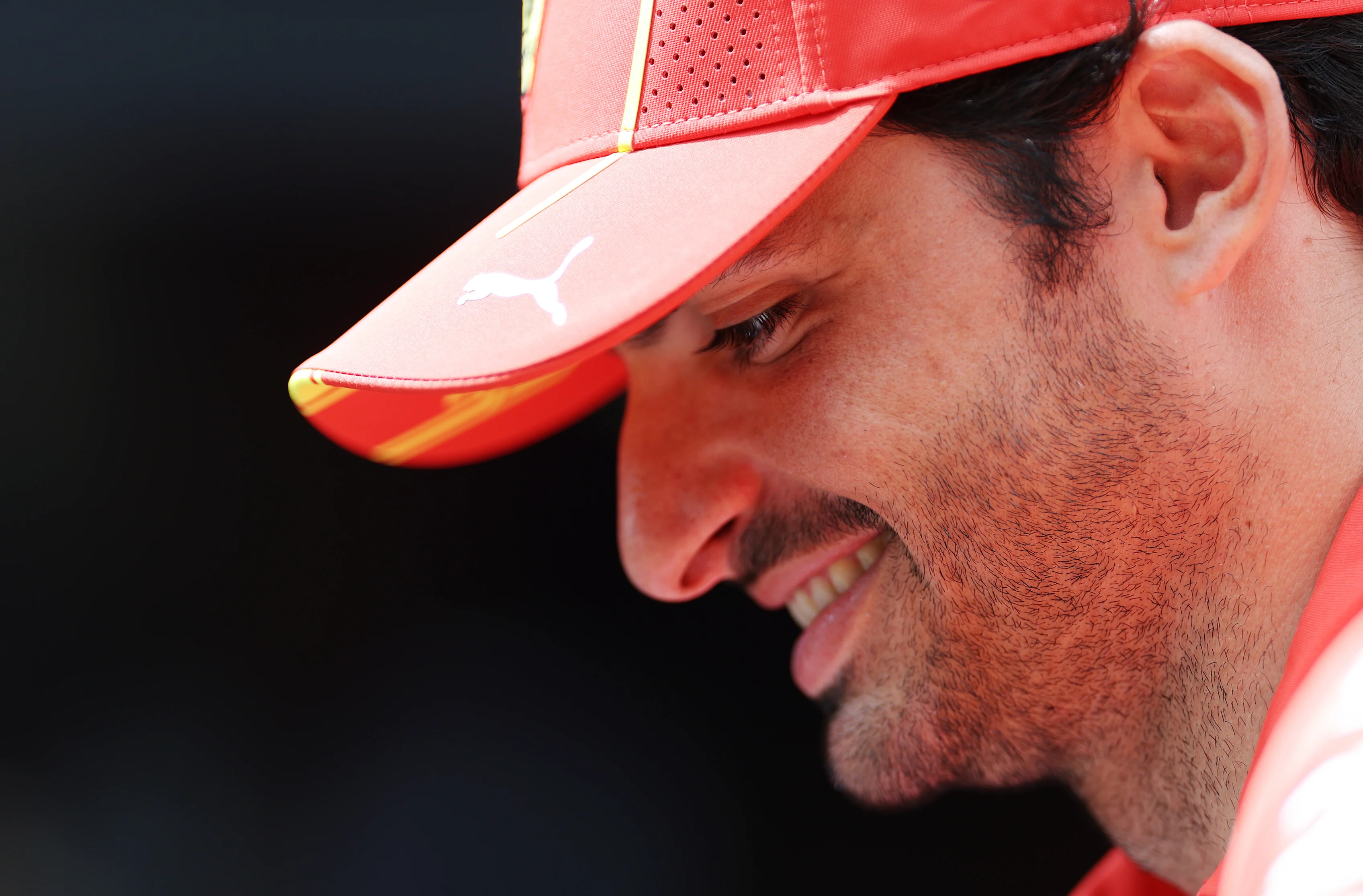 SPA, BELGIUM - JULY 25: Carlos Sainz of Spain and Ferrari looks on in the Paddock during previews