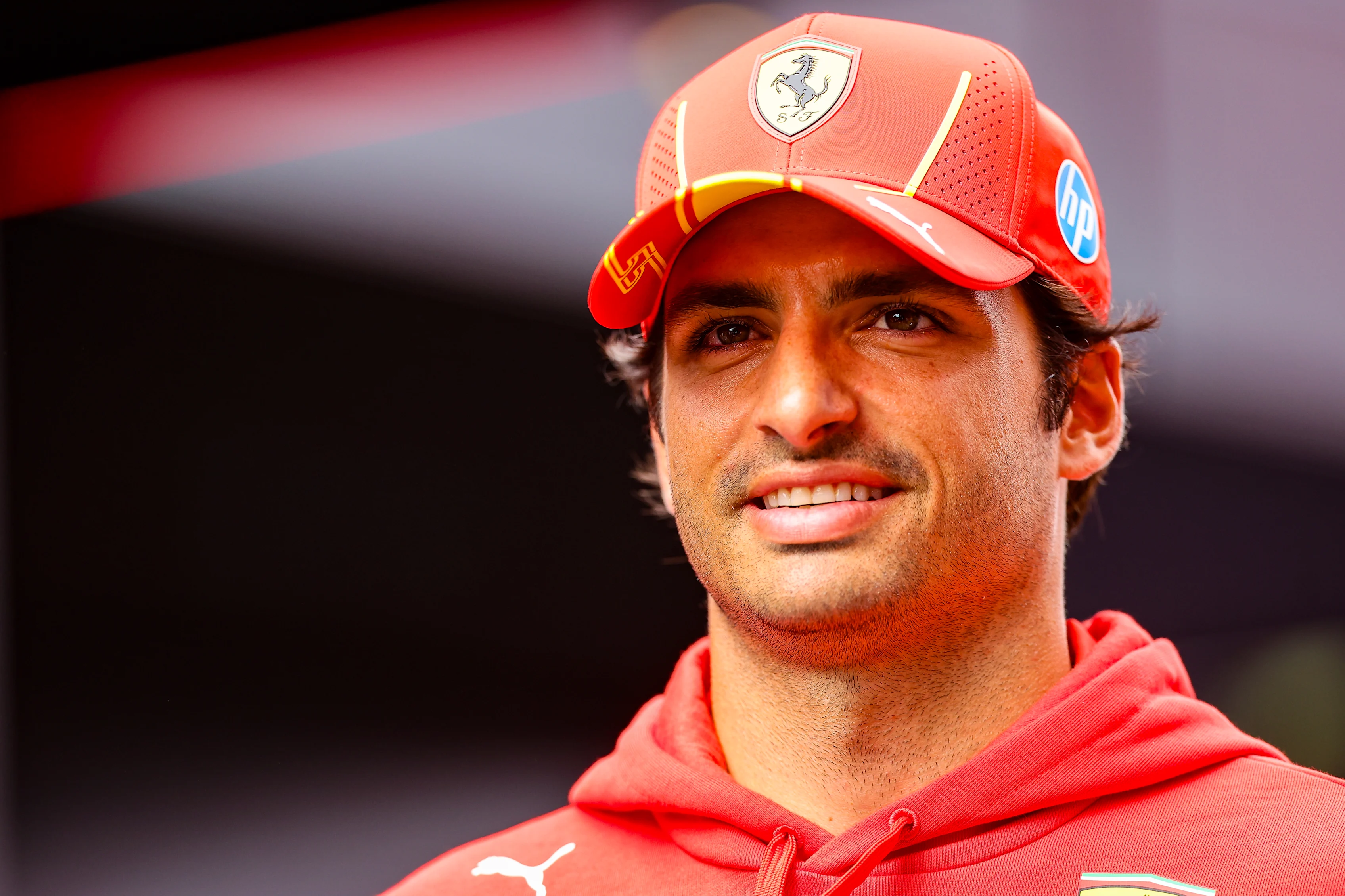 ZANDVOORT, NETHERLANDS - AUGUST 22: Carlos Sainz of Spain and Ferrari looks on in the paddock