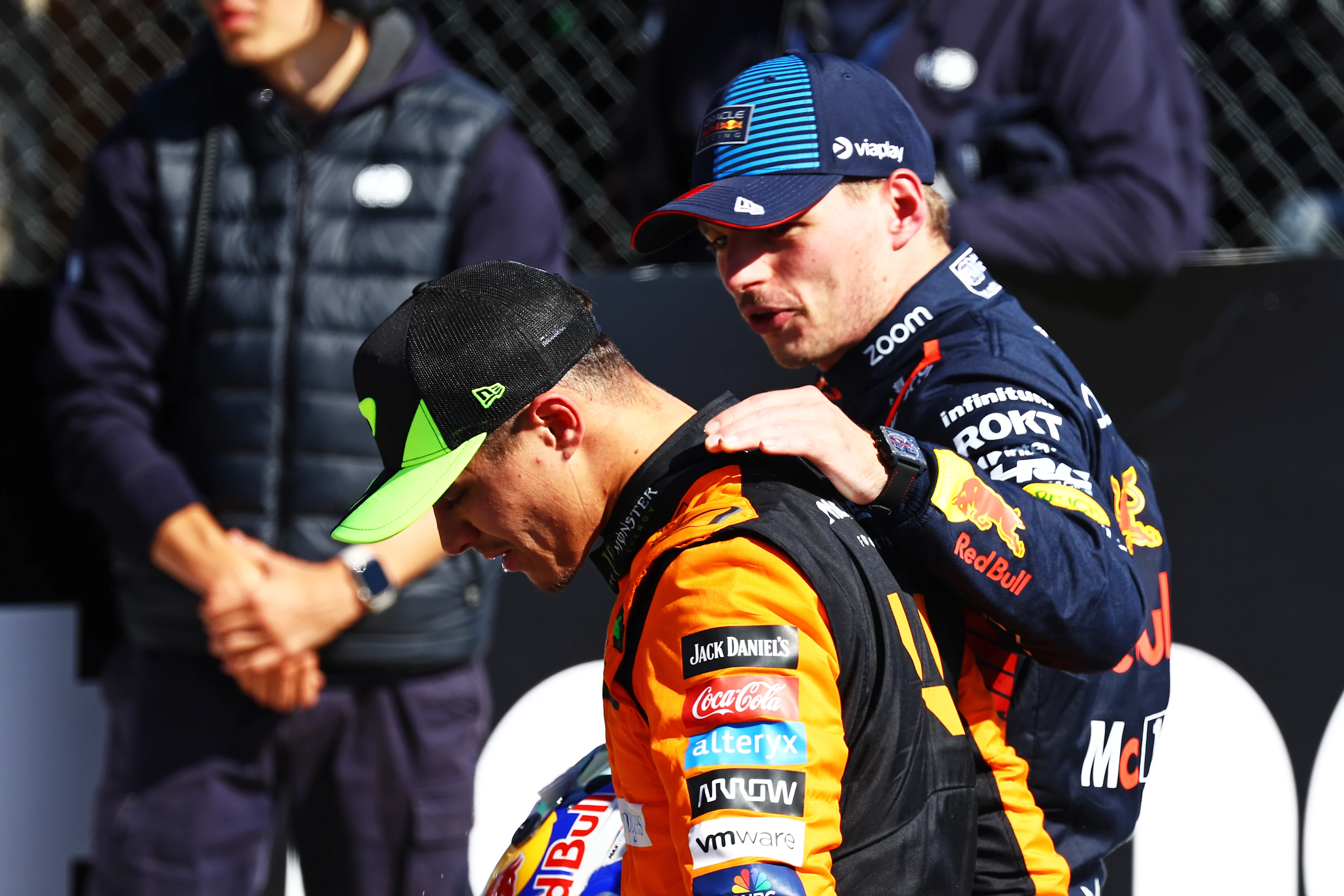 NORTHAMPTON, ENGLAND - JULY 07: Second placed Max Verstappen and Third placed Lando Norris talk in parc ferme during the F1 Grand Prix of Great Britain at Silverstone Circuit on July 07, 2024. (Photo by Mark Thompson/Getty Images)