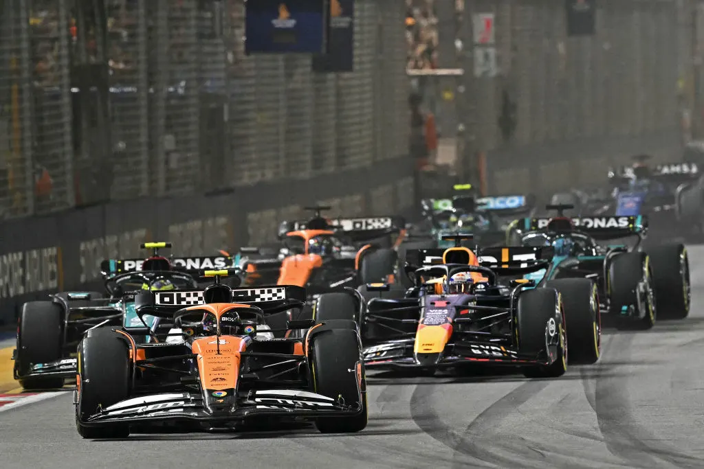 McLaren's British driver Lando Norris (front) leads the pack as he drives at the start of the
