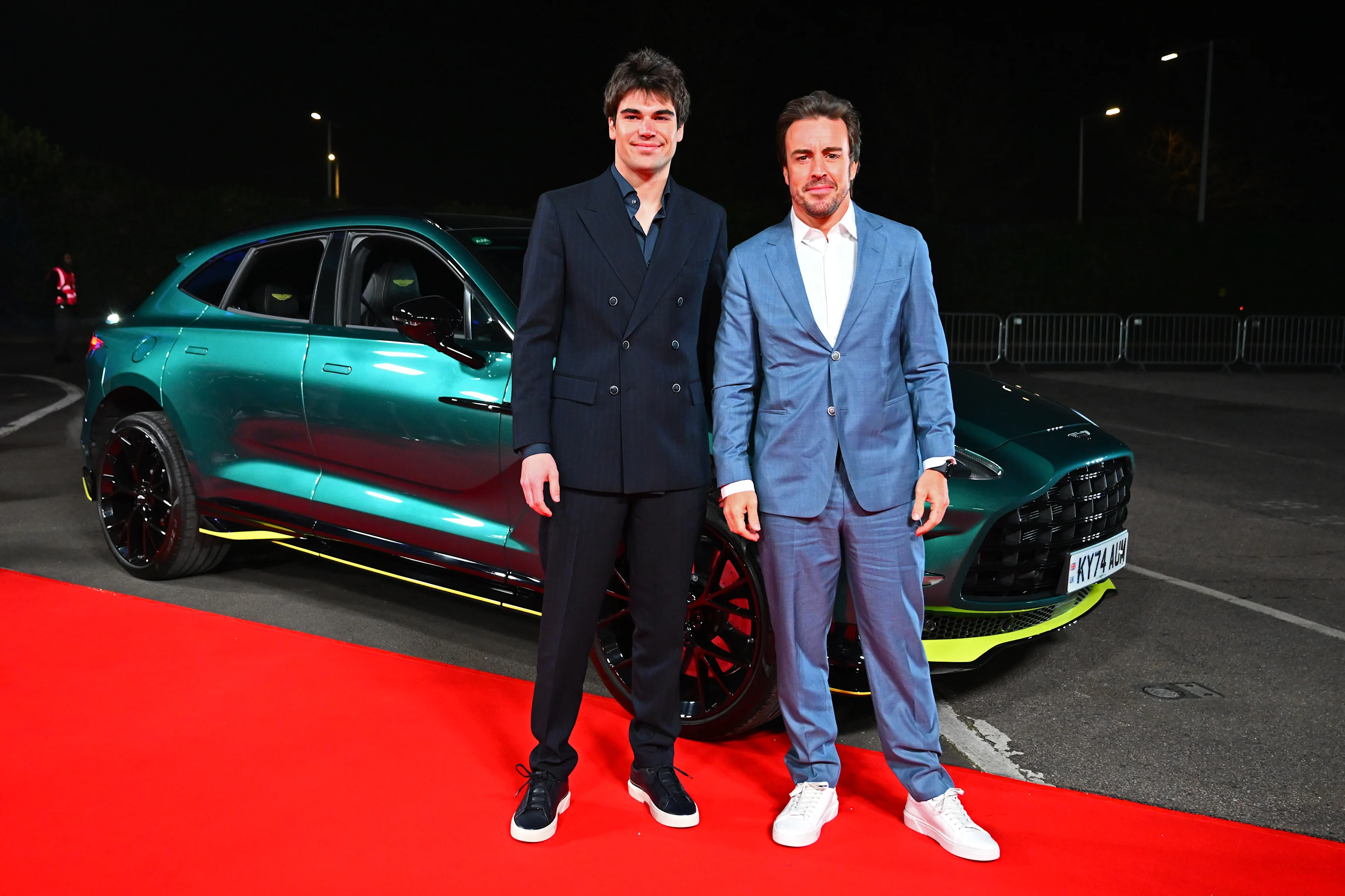 LONDON, ENGLAND - FEBRUARY 18: Lance Stroll of Canada and Aston Martin F1 Team Fernando Alonso of