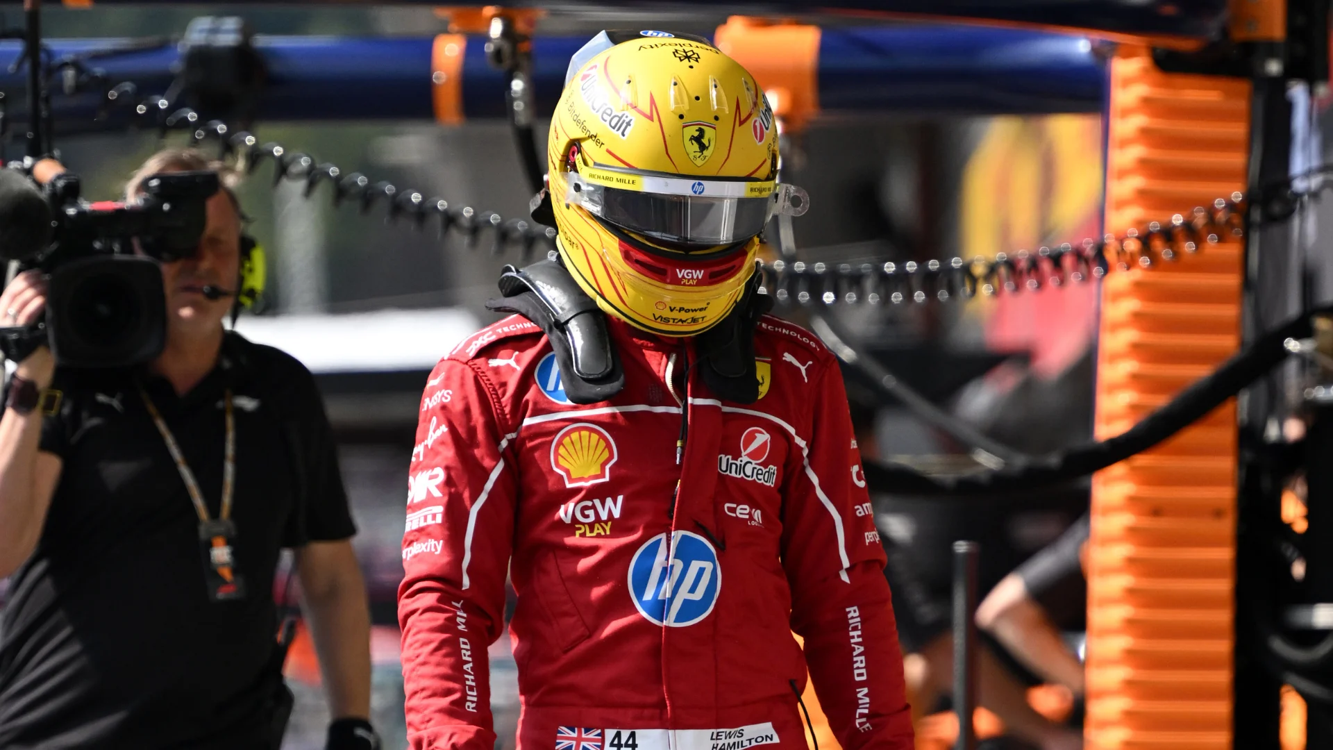 SPA, BELGIUM - JULY 25: Lewis Hamilton of Great Britain and Scuderia Ferrari walks in the Pitlane