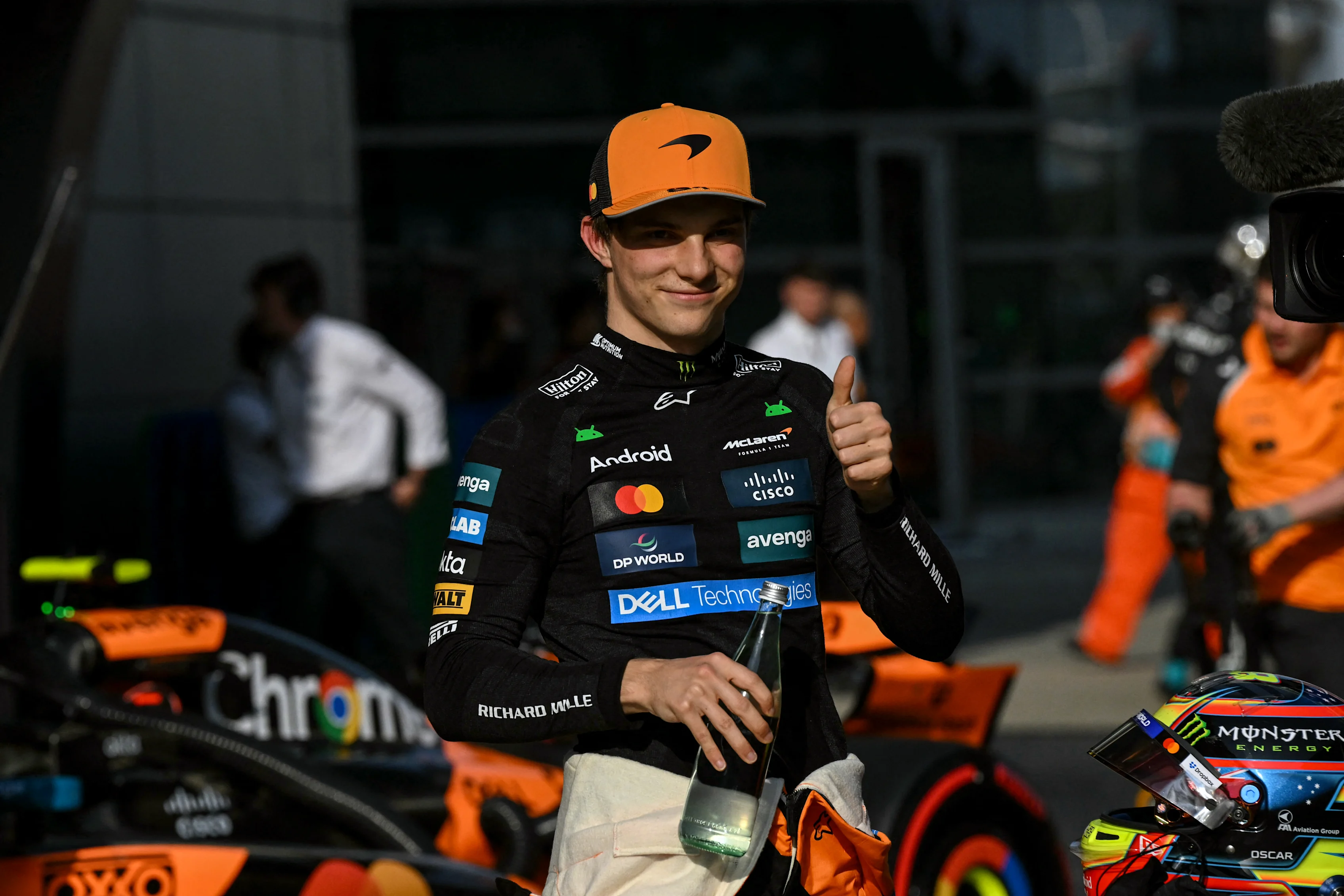 TOPSHOT - McLaren's Australian driver Oscar Piastri gives a thumbs as he celebrates taking pole