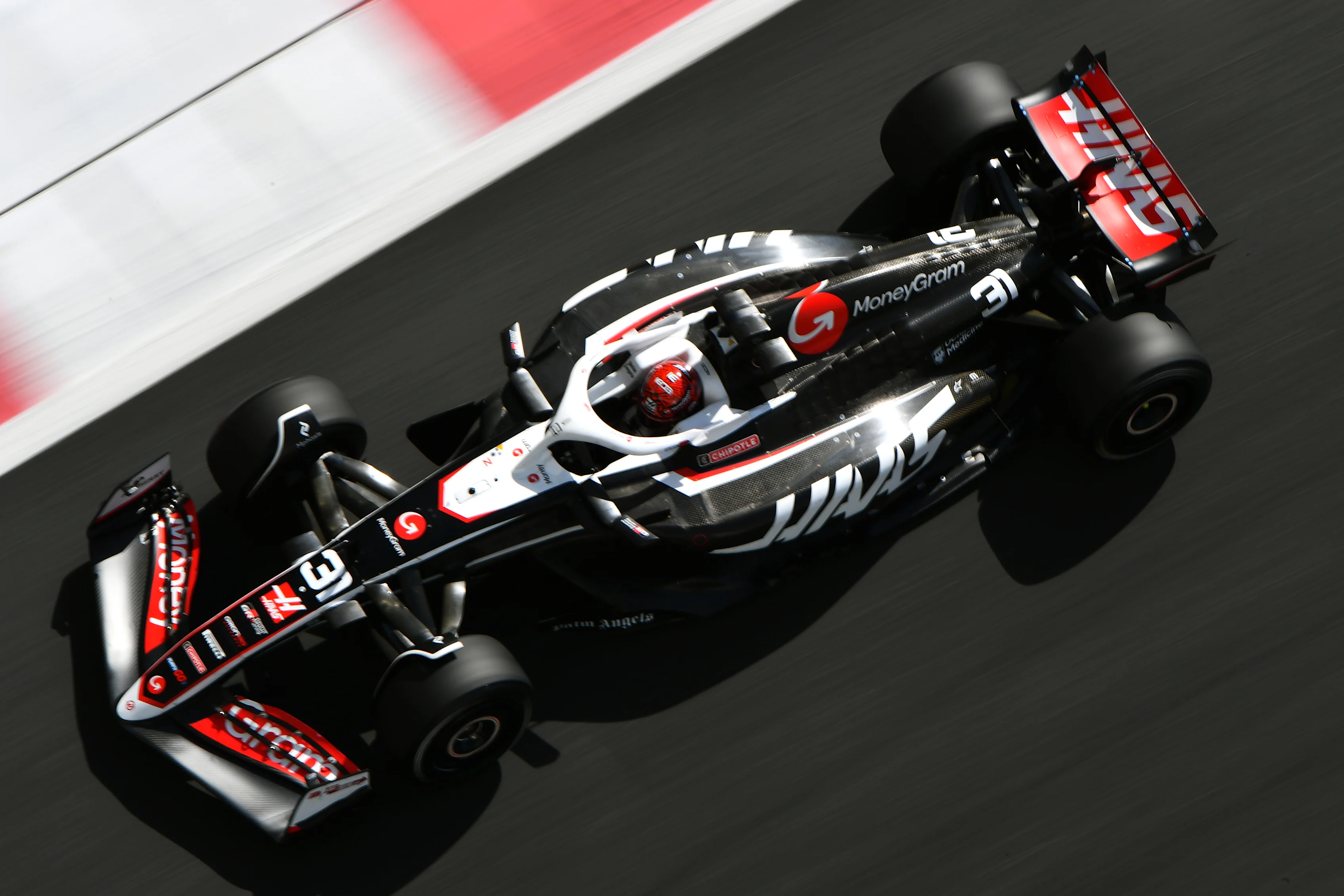 ABU DHABI, UNITED ARAB EMIRATES - DECEMBER 10: Esteban Ocon of France driving the (31) Haas F1