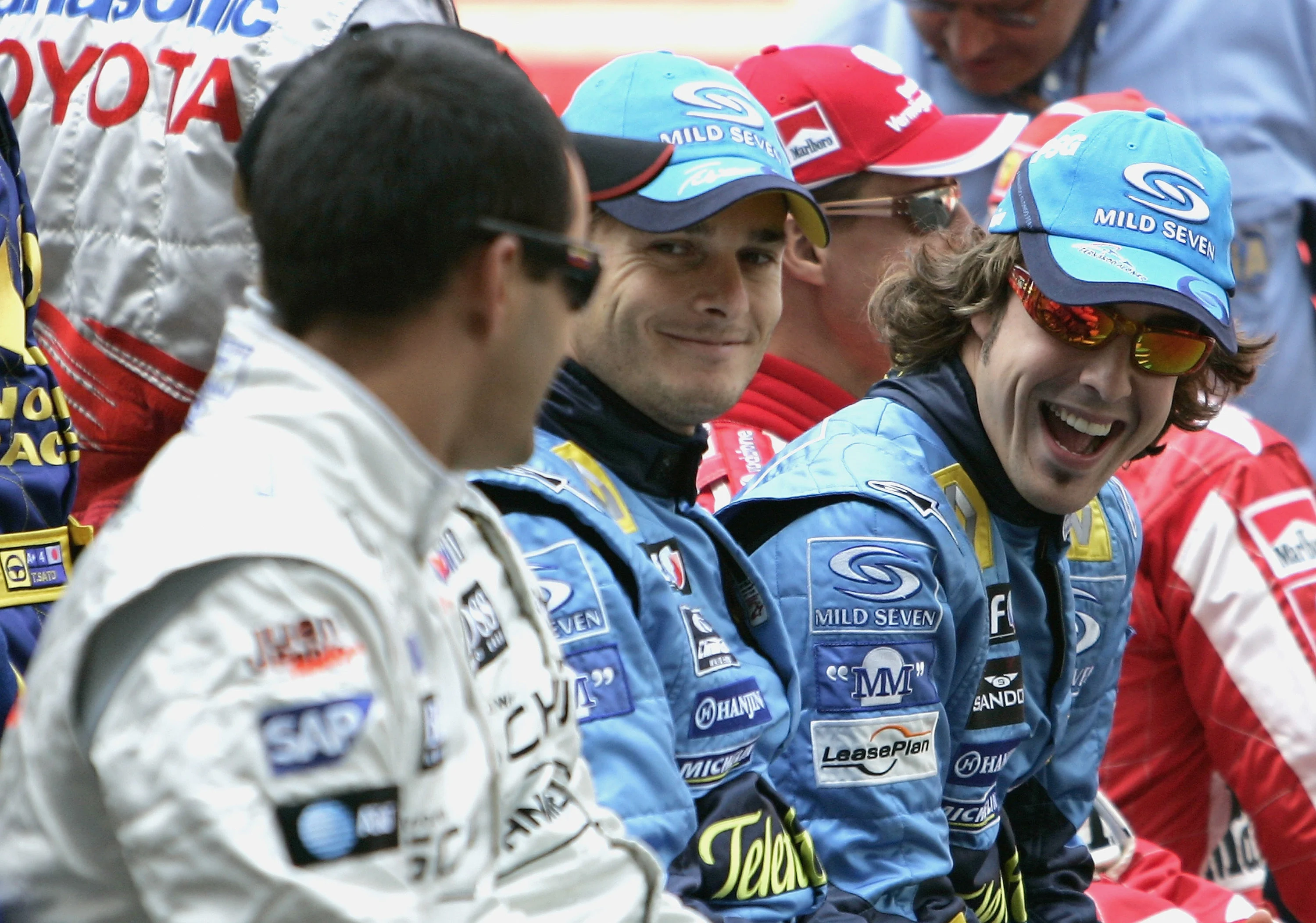 SHANGHAI, CHINA - OCTOBER 16:  Fernando Alonso of Spain and Renault shares a joke with Juan Pablo