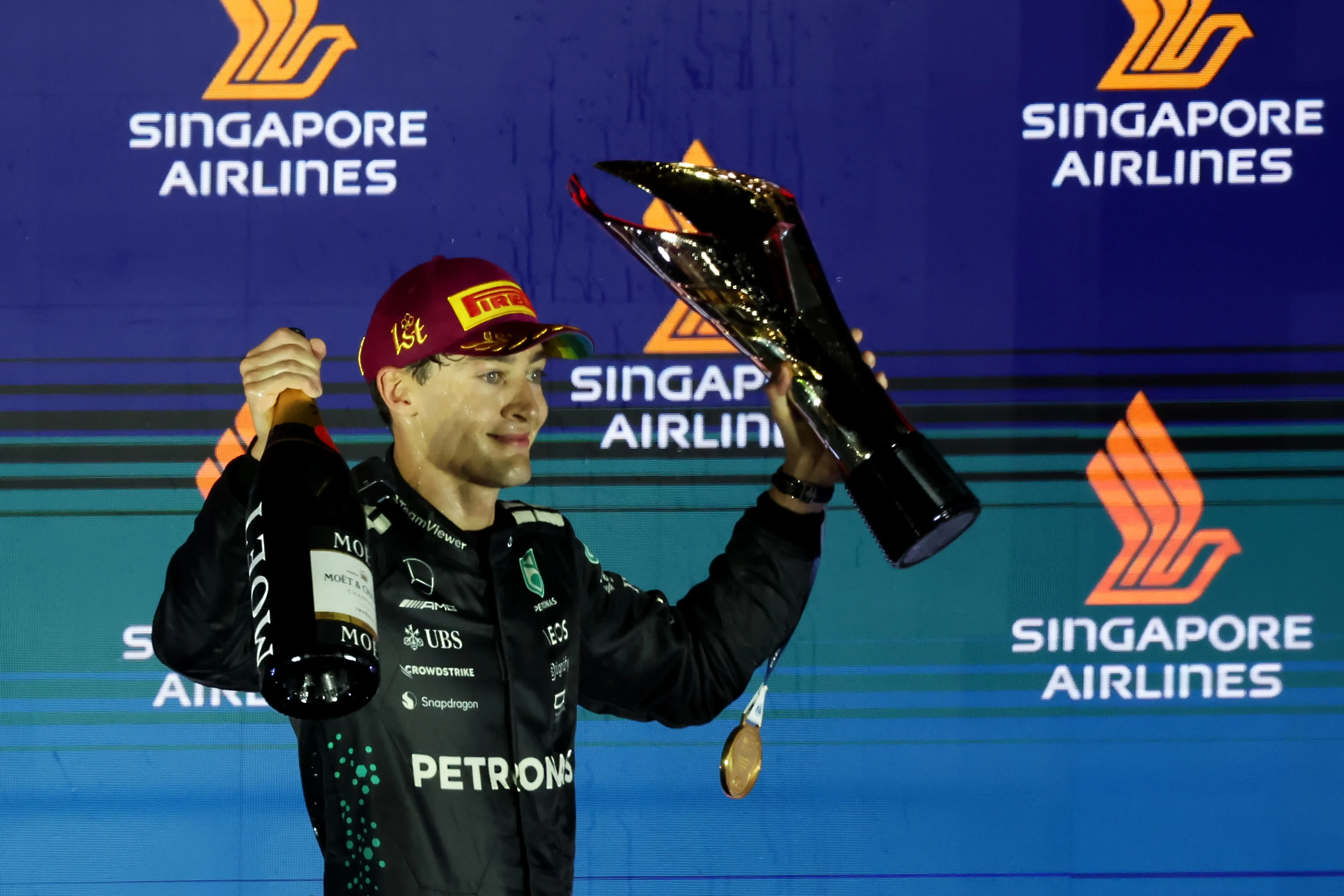 SINGAPORE, SINGAPORE - OCTOBER 05: Race winner George Russell of Great Britain and Mercedes AMG