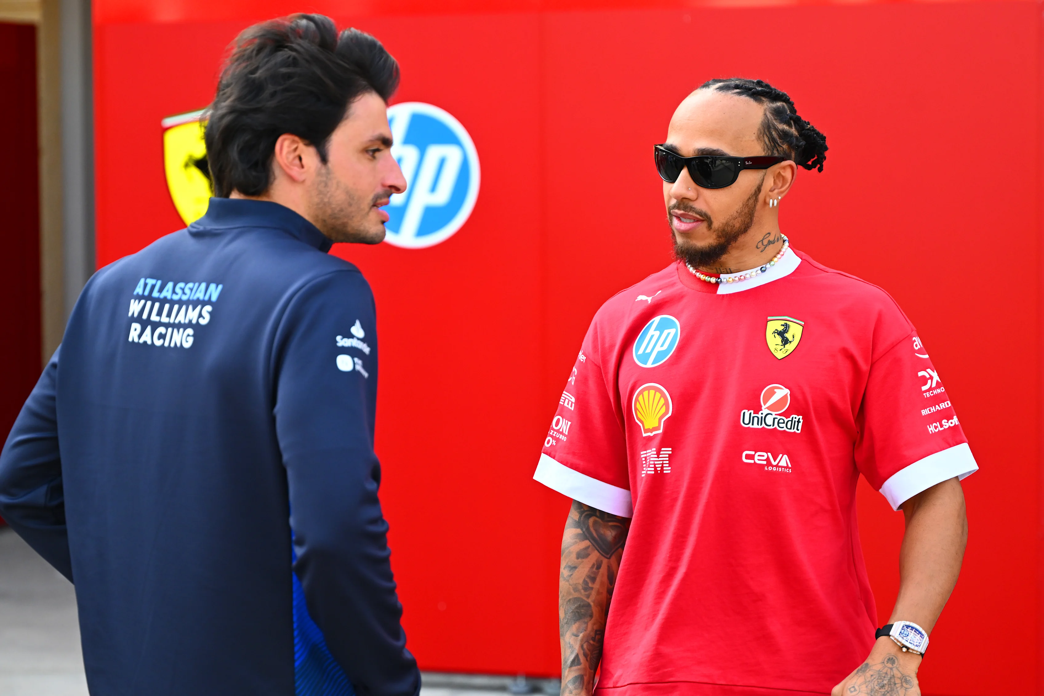 BAHRAIN, BAHRAIN - FEBRUARY 28: Lewis Hamilton of Great Britain and Scuderia Ferrari talks with