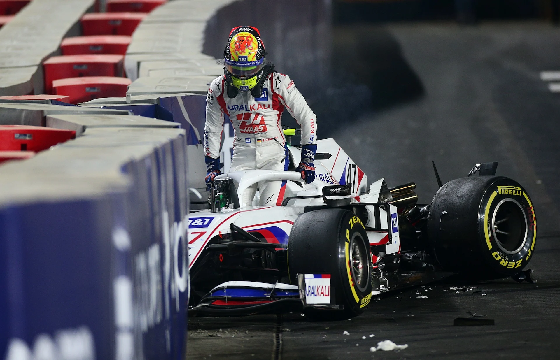 Mick Schumacher of Germany driving the (47) Haas F1 Team VF-21 Ferrari climbs from his car after crashing during the F1 Grand Prix of Saudi Arabia at Jeddah Corniche Circuit on December 05, 2021 in Jeddah, Saudi Arabia. (Photo by Peter Fox/Getty Images)