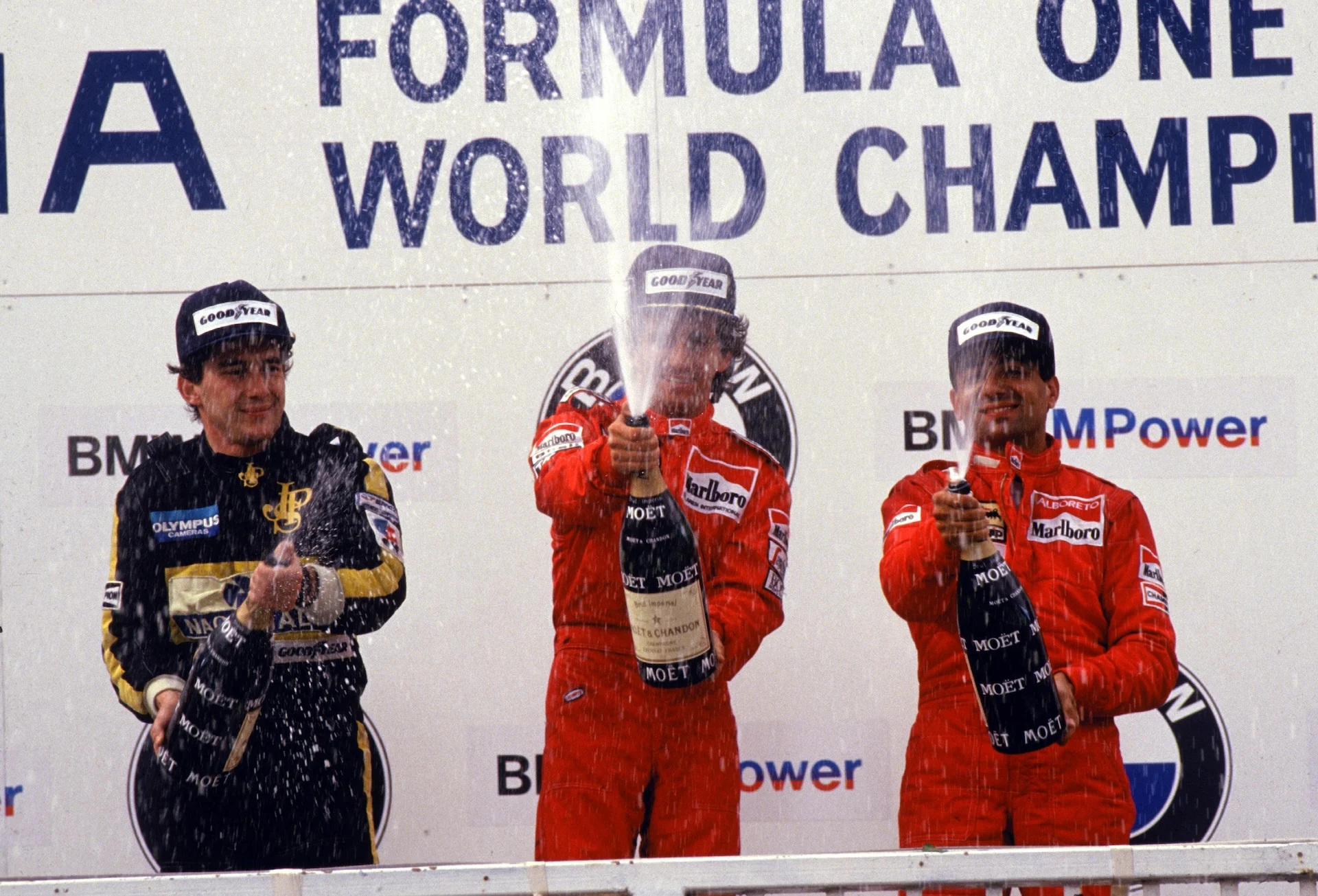 The podium (L to R): Ayrton Senna (BRA) Lotus second; Alain Prost (FRA) McLaren winner; Michele